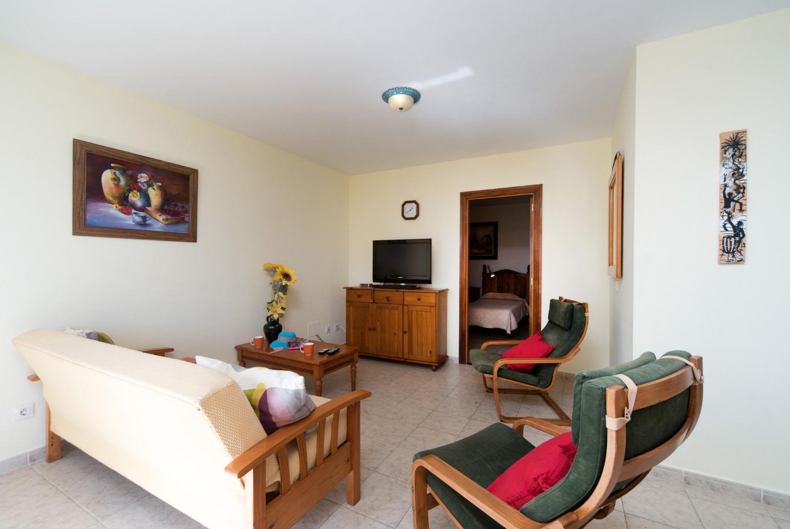Living room with WiFi, TV, DVD player and terrace accessLiving room with WiFi, TV, DVD player and terrace access