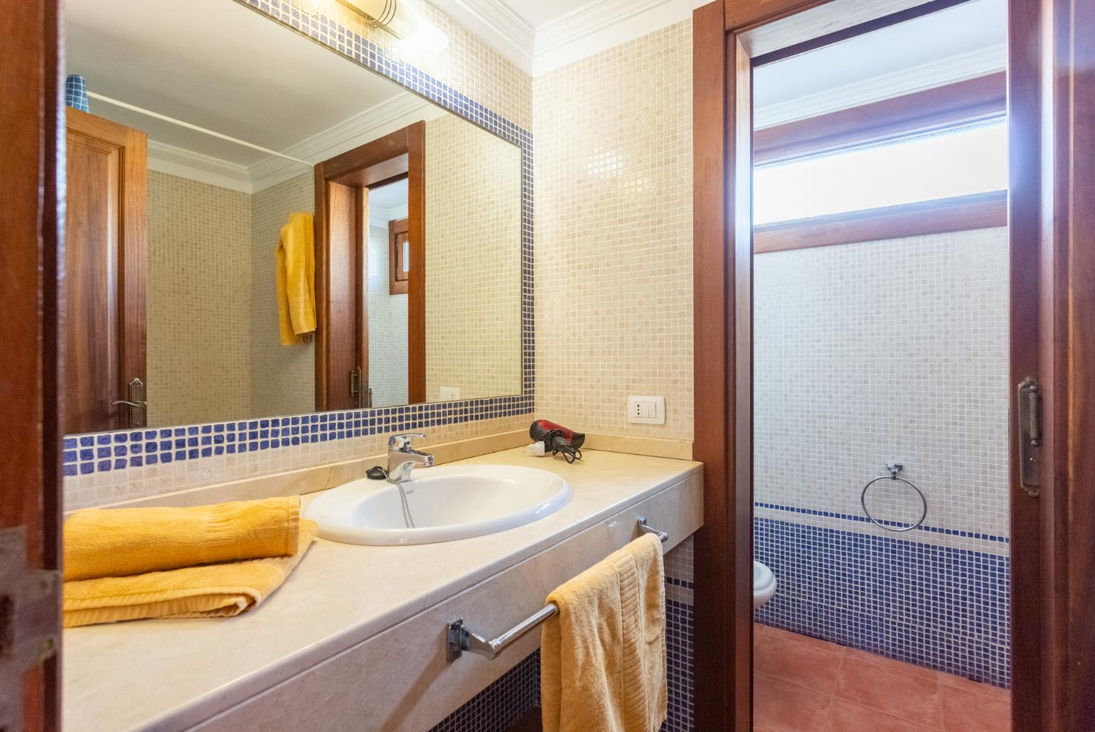 Family bathroom with bath and shower