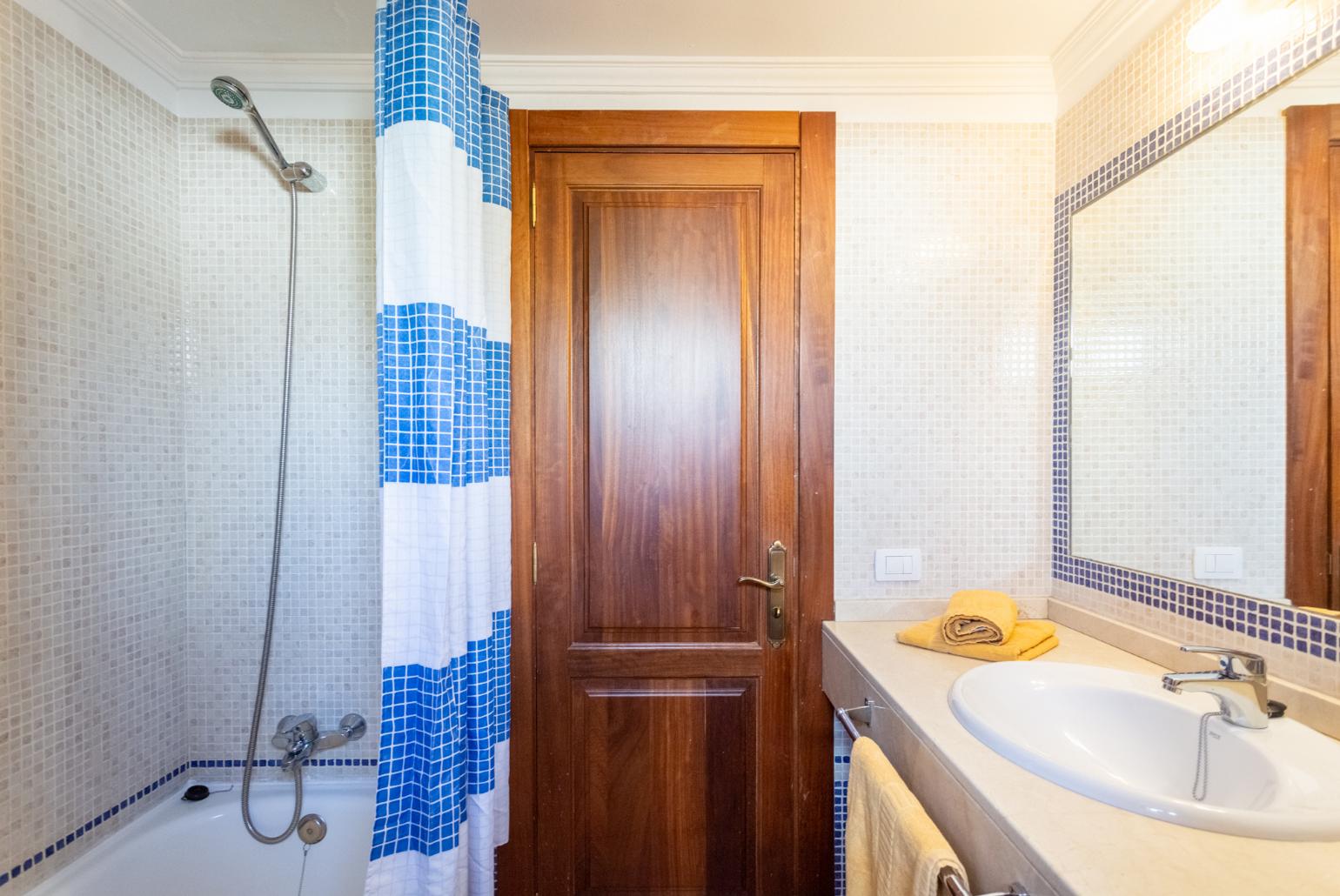 Family bathroom with bath and shower