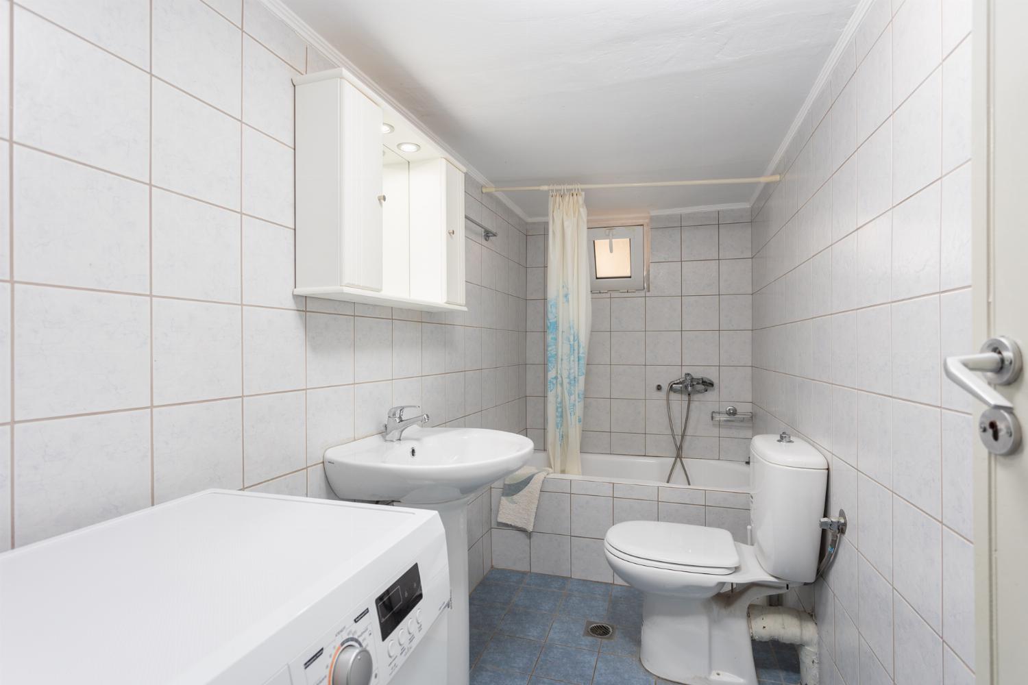 Family bathroom with bath and shower