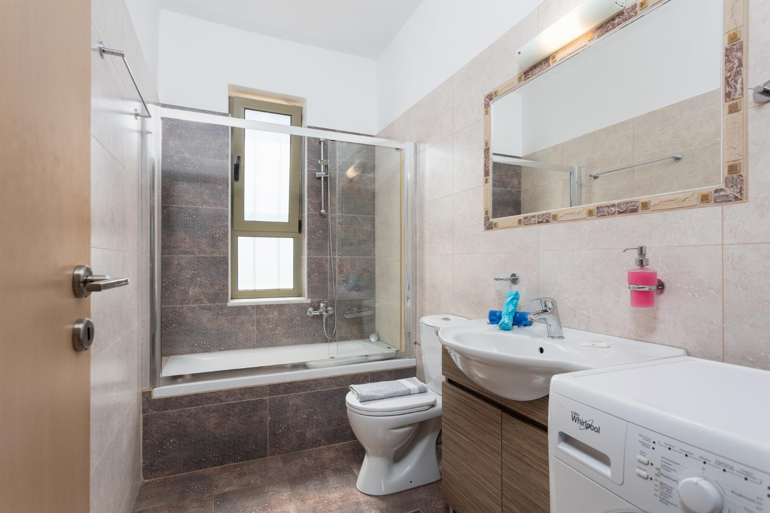 Family bathroom with bath and shower