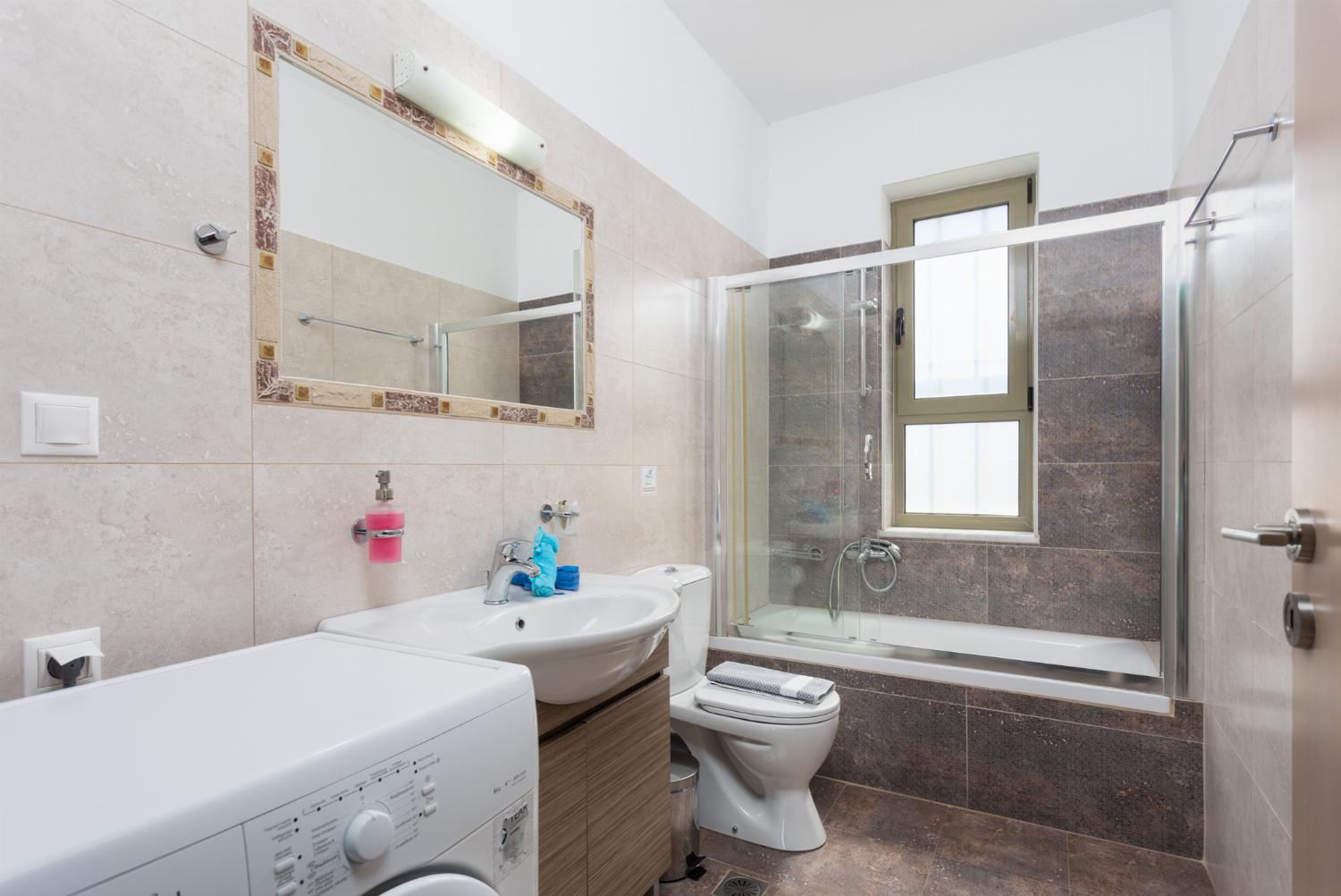 Family bathroom with bath and shower