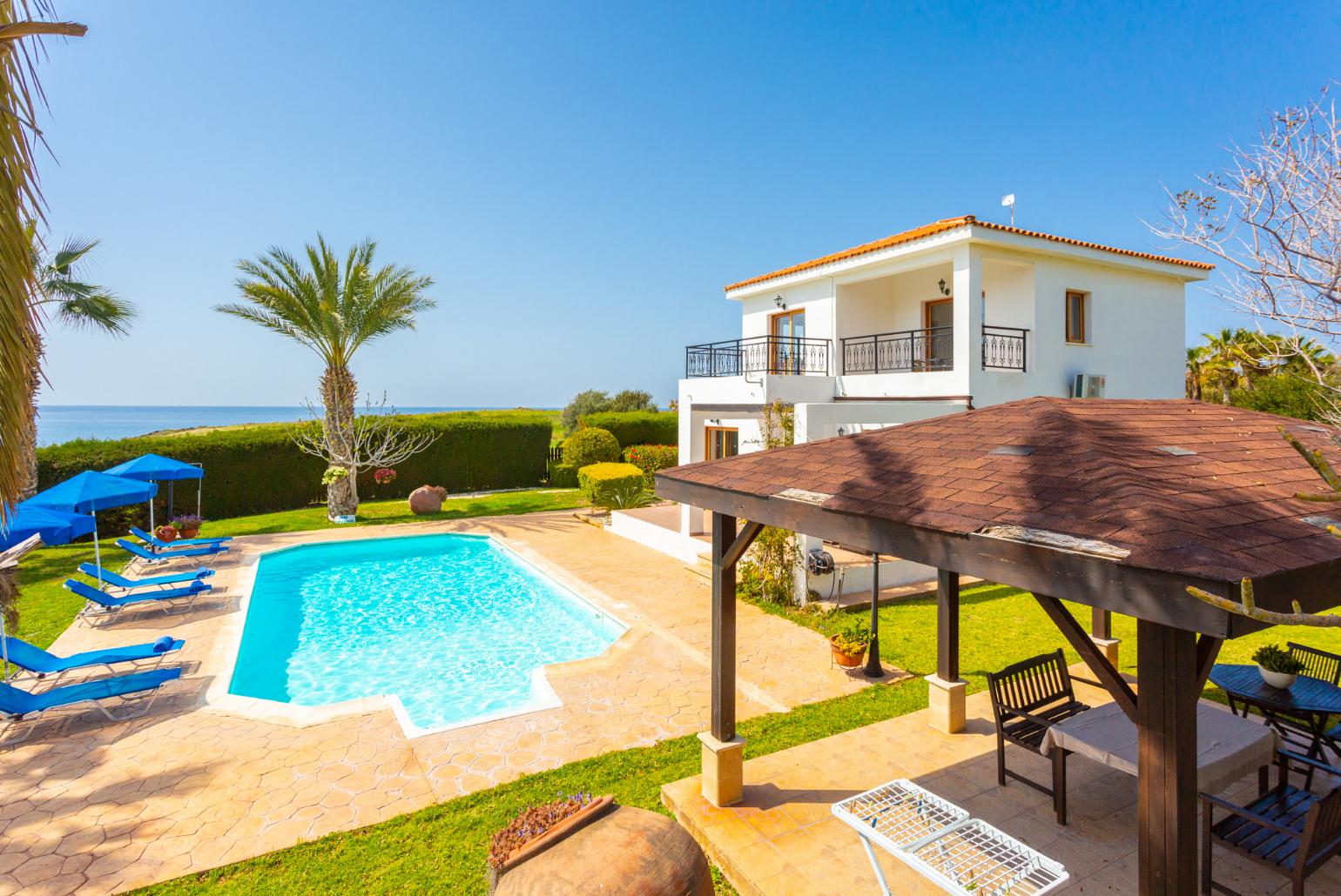 Private pool, terrace, and garden with panoramic sea views