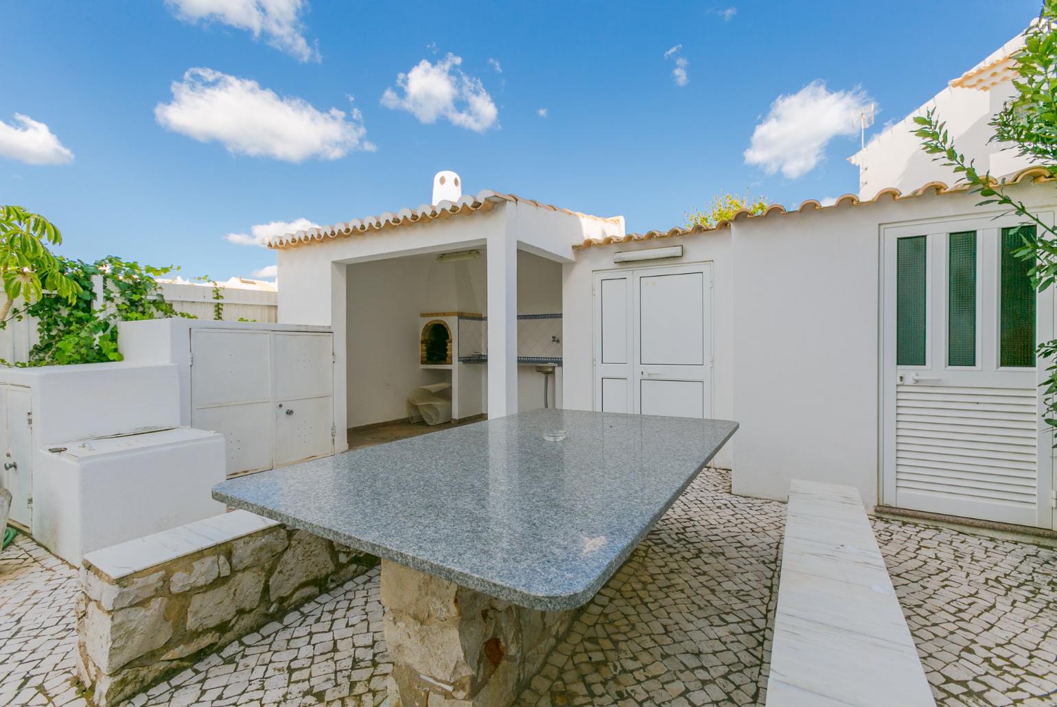 Outdoor table with BBQ area