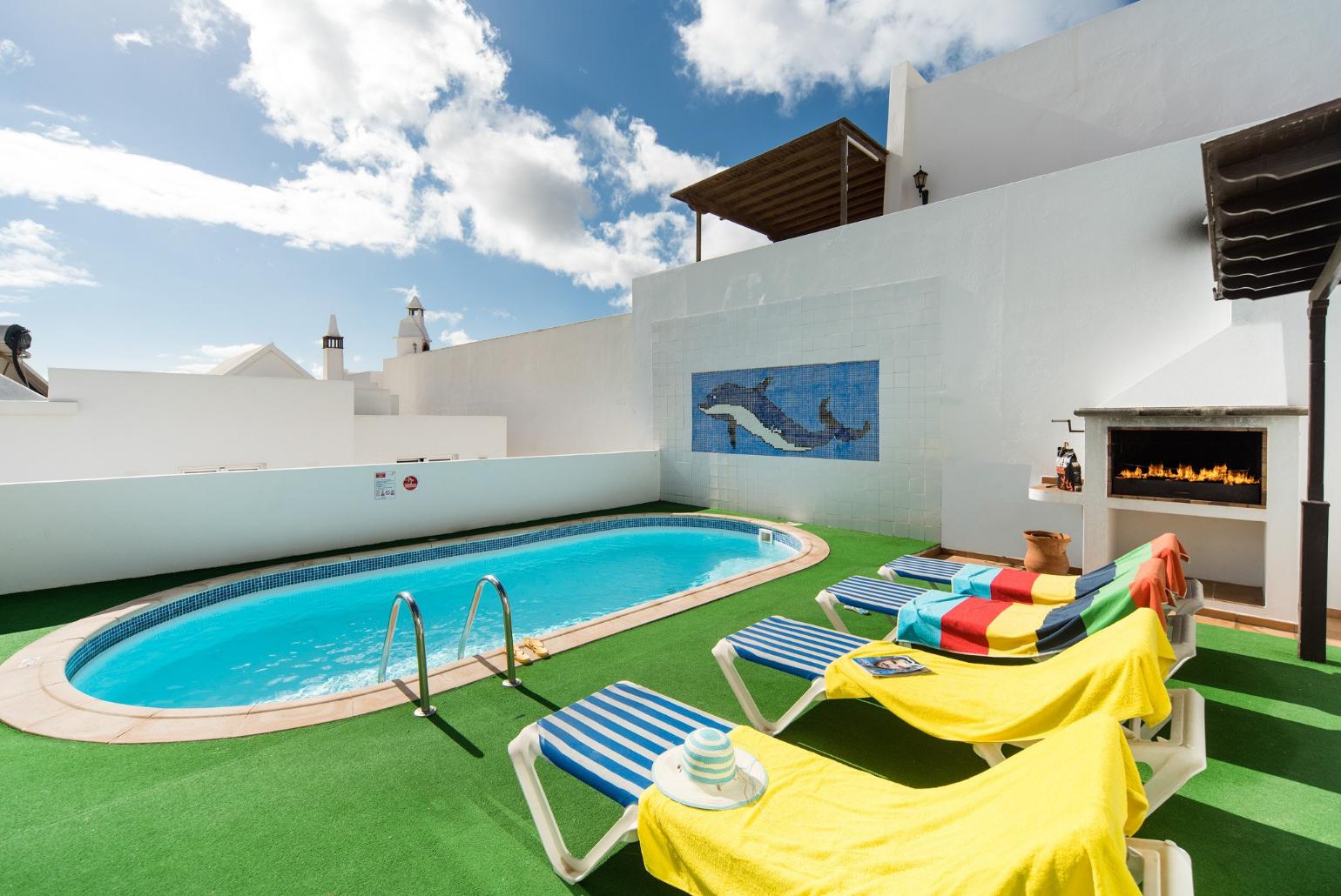 Swimming Pool With Sun Loungers