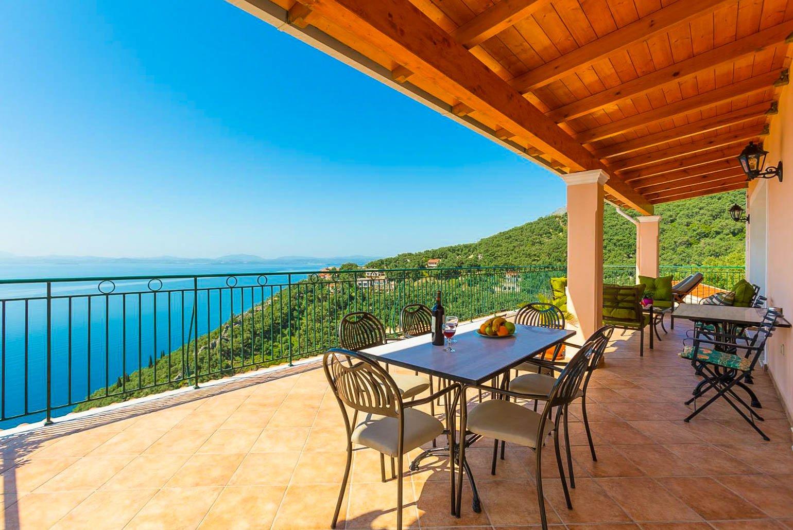 Balcony on first floor with outdoor seating and panoramic views