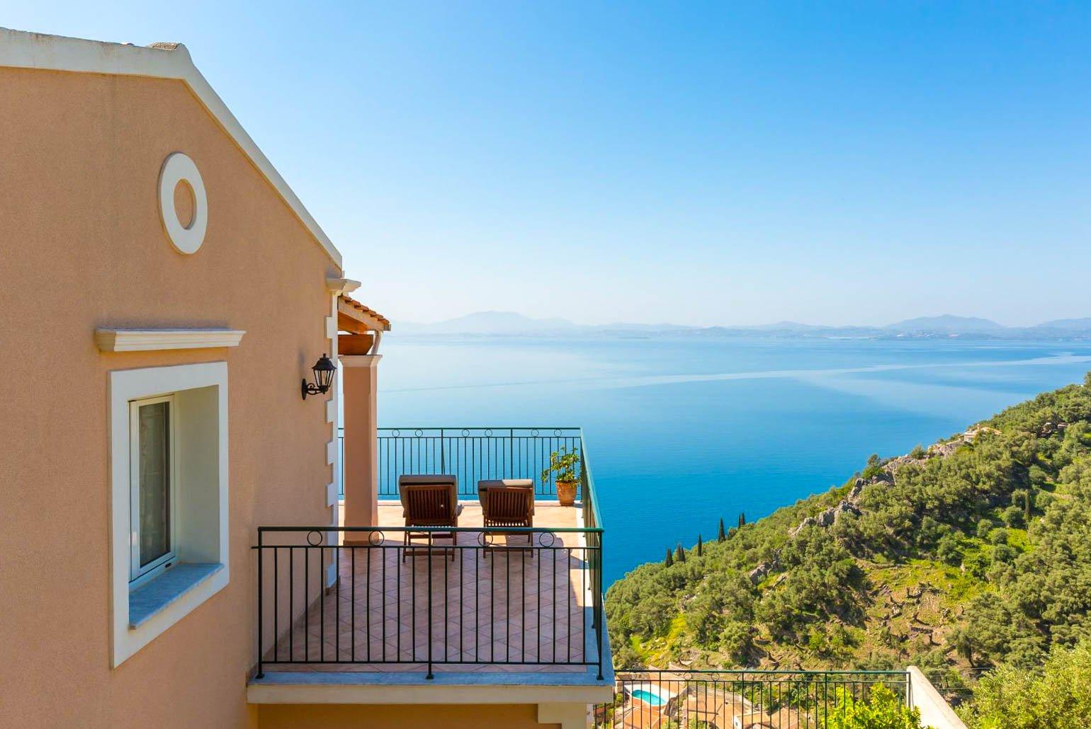 Balcony on first floor with outdoor seating and panoramic views