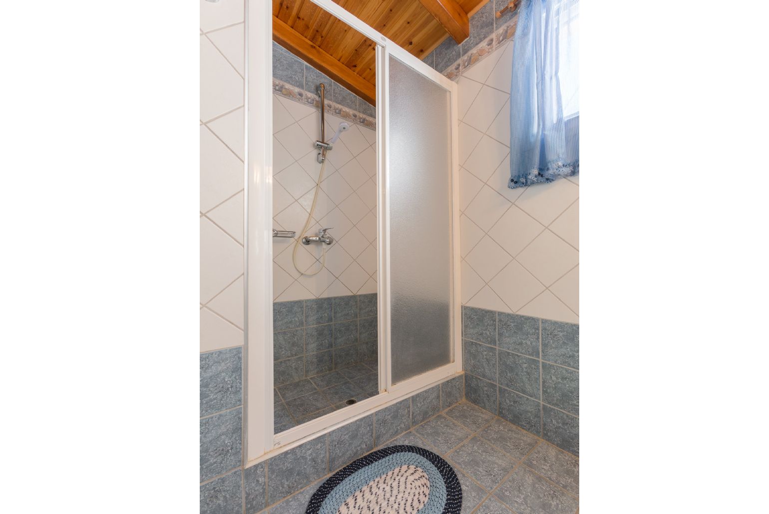 Family bathroom with bath and overhead shower