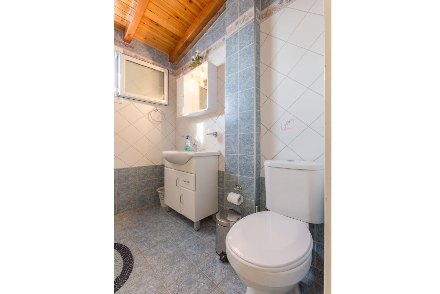 Family bathroom with bath and overhead shower