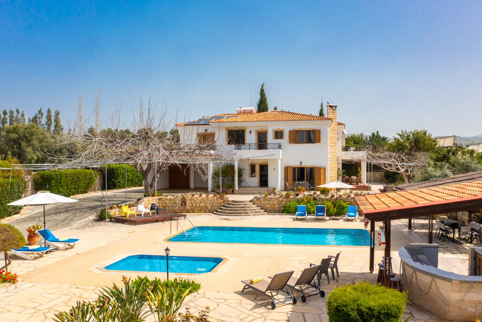 ,Beautiful villa with private pool, terrace, and garden with sea views