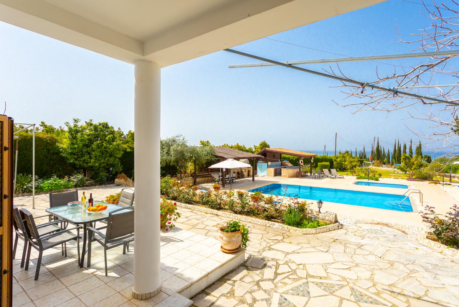 Private pool, terrace, and garden with sea views