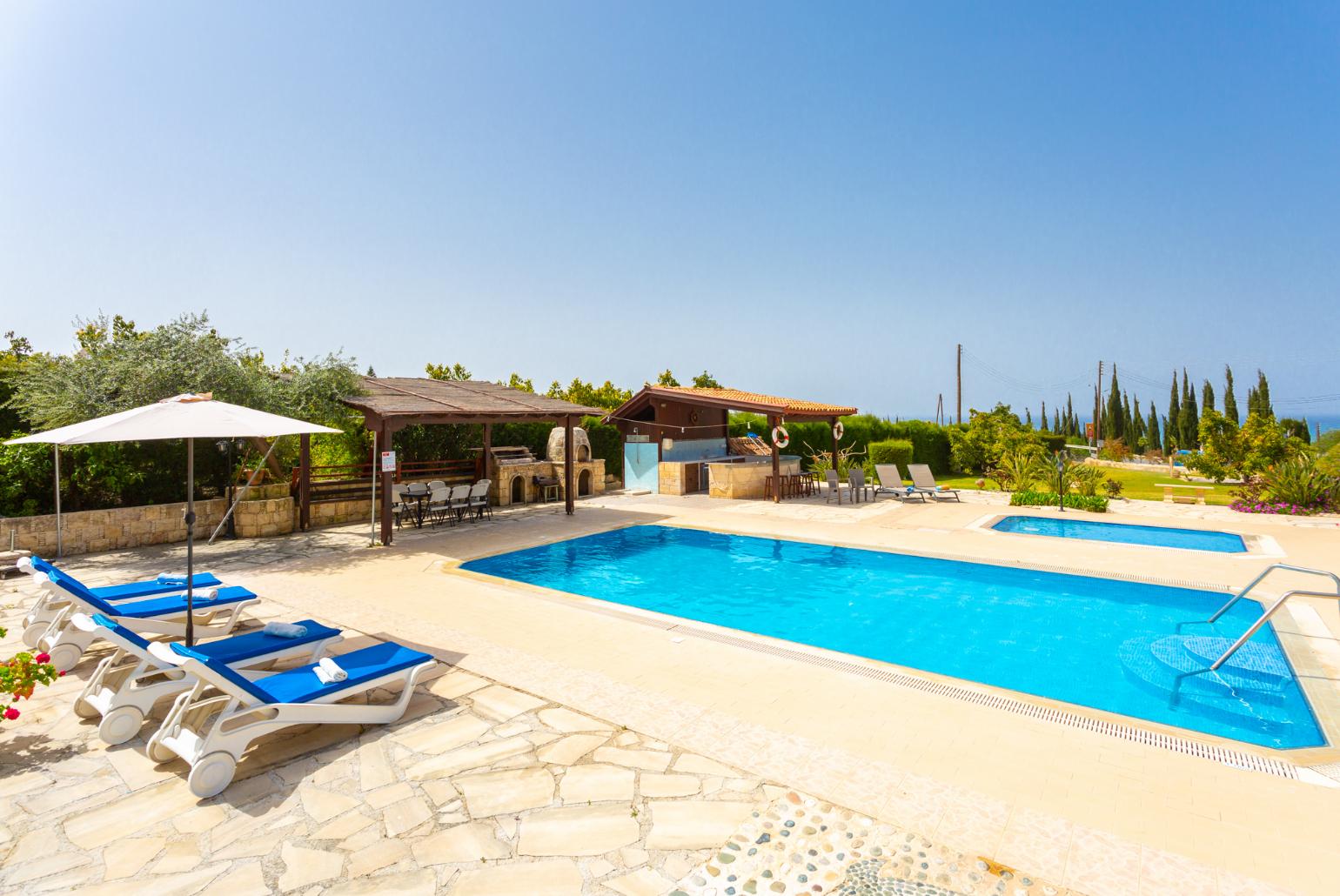 Private pool, terrace, and garden with sea views