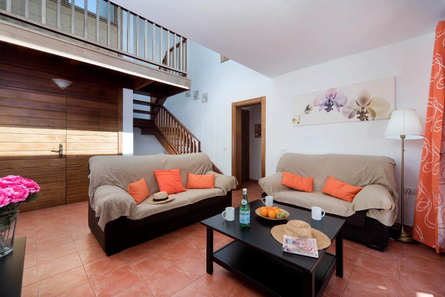 Living room with sofas, WiFi internet, satellite TV, DVD player and terrace access