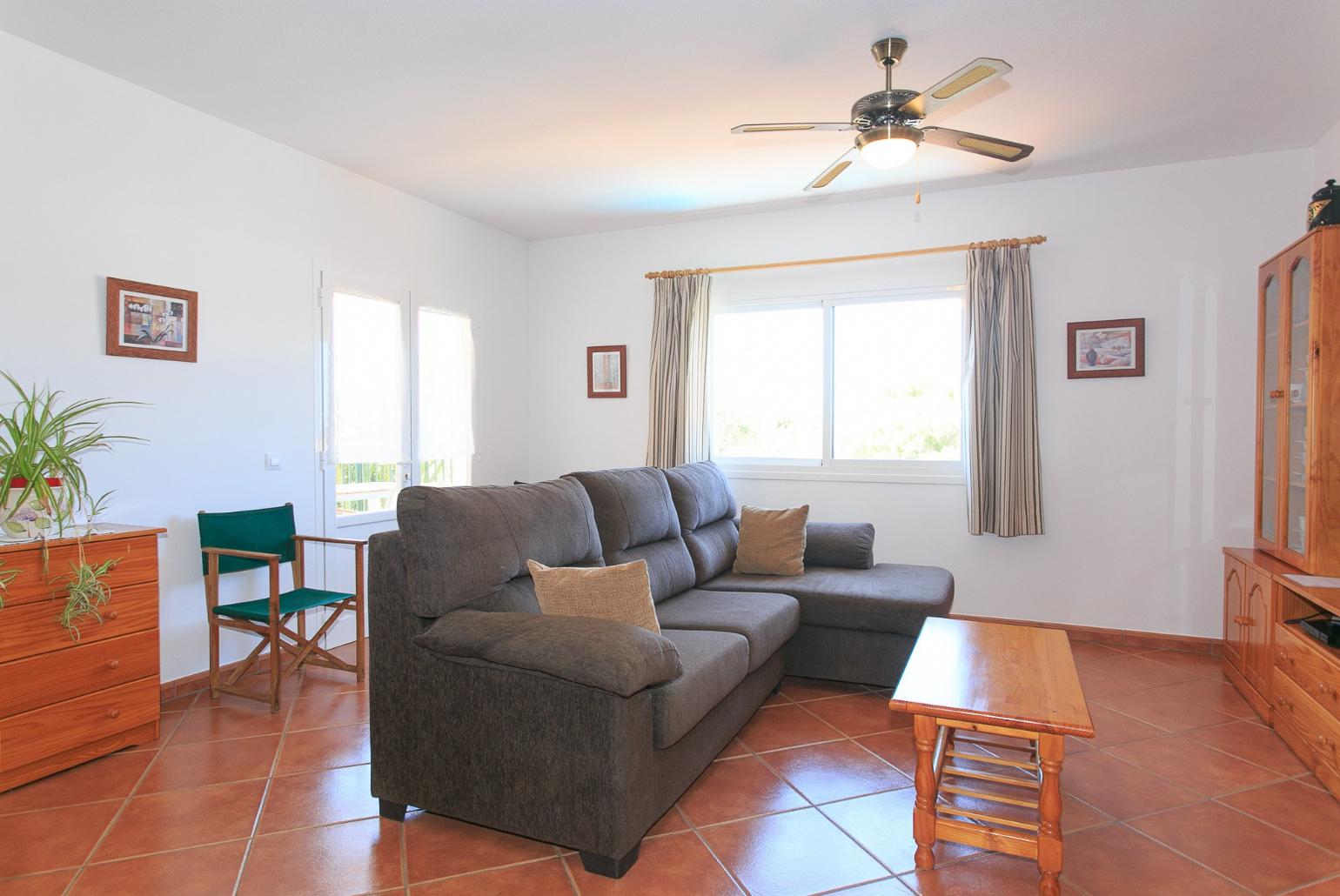 Living room with WiFi, TV, DVD player and terrace access