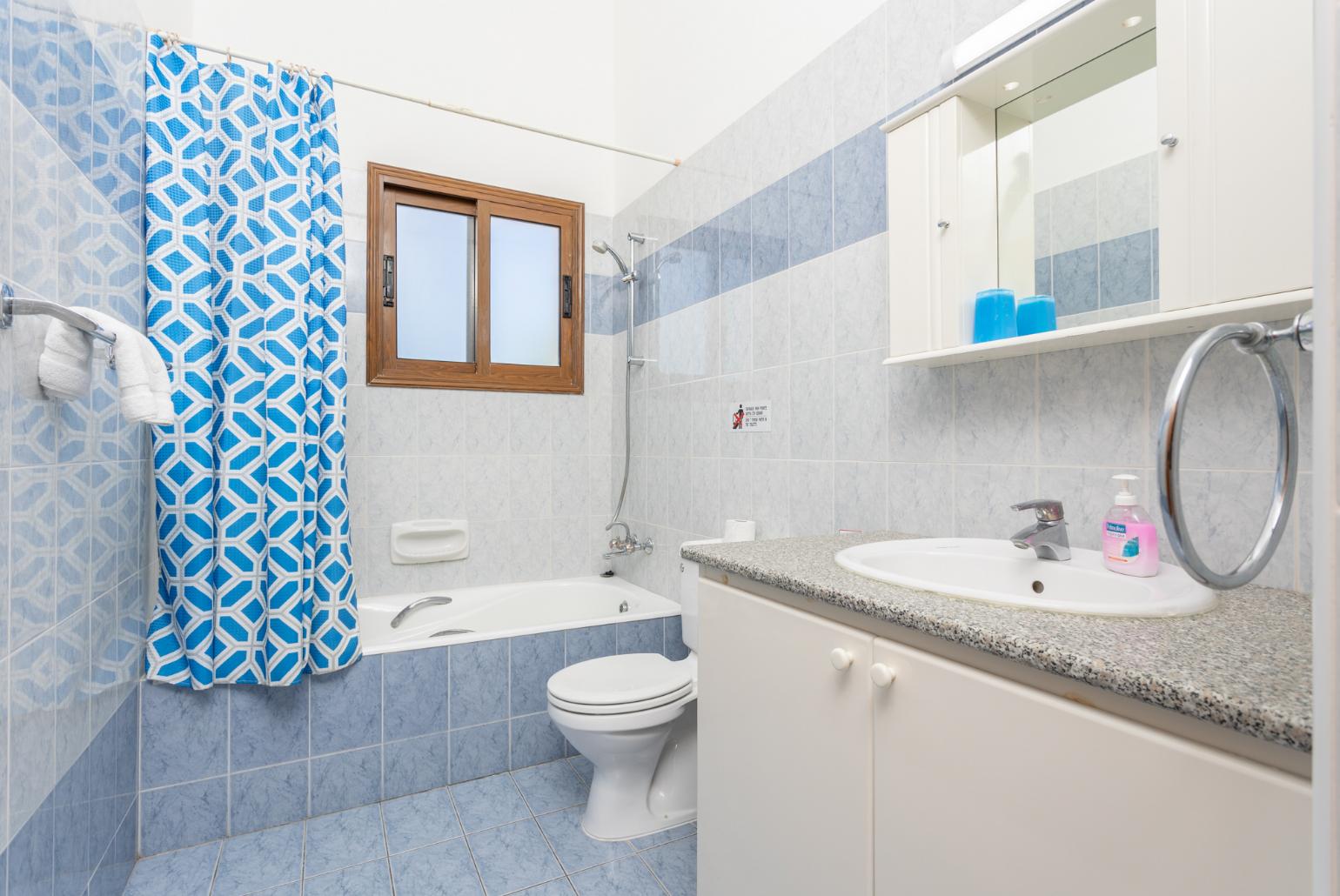 Family bathroom with bath and shower