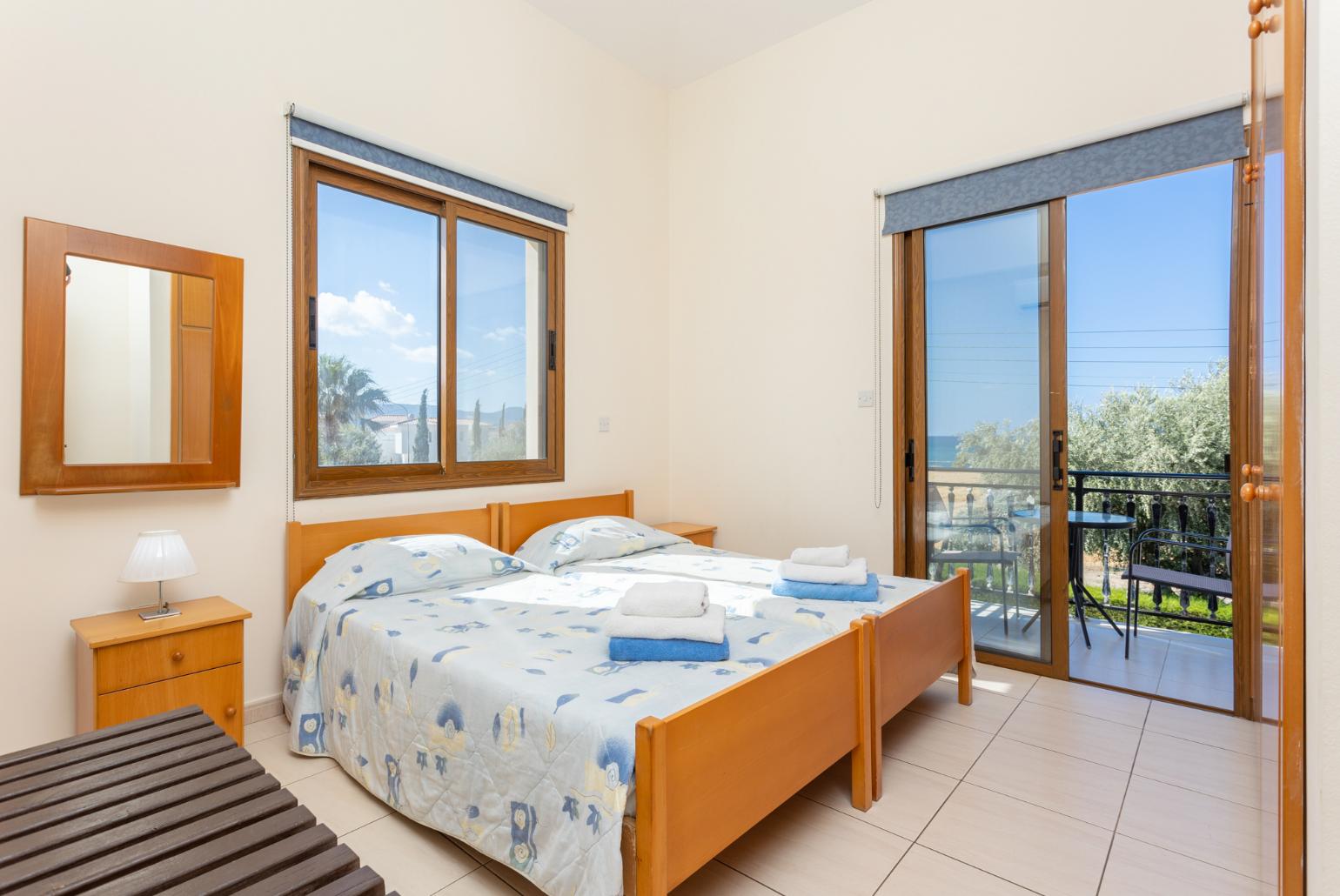 Twin bedroom with with A/C, sea views, and balcony access