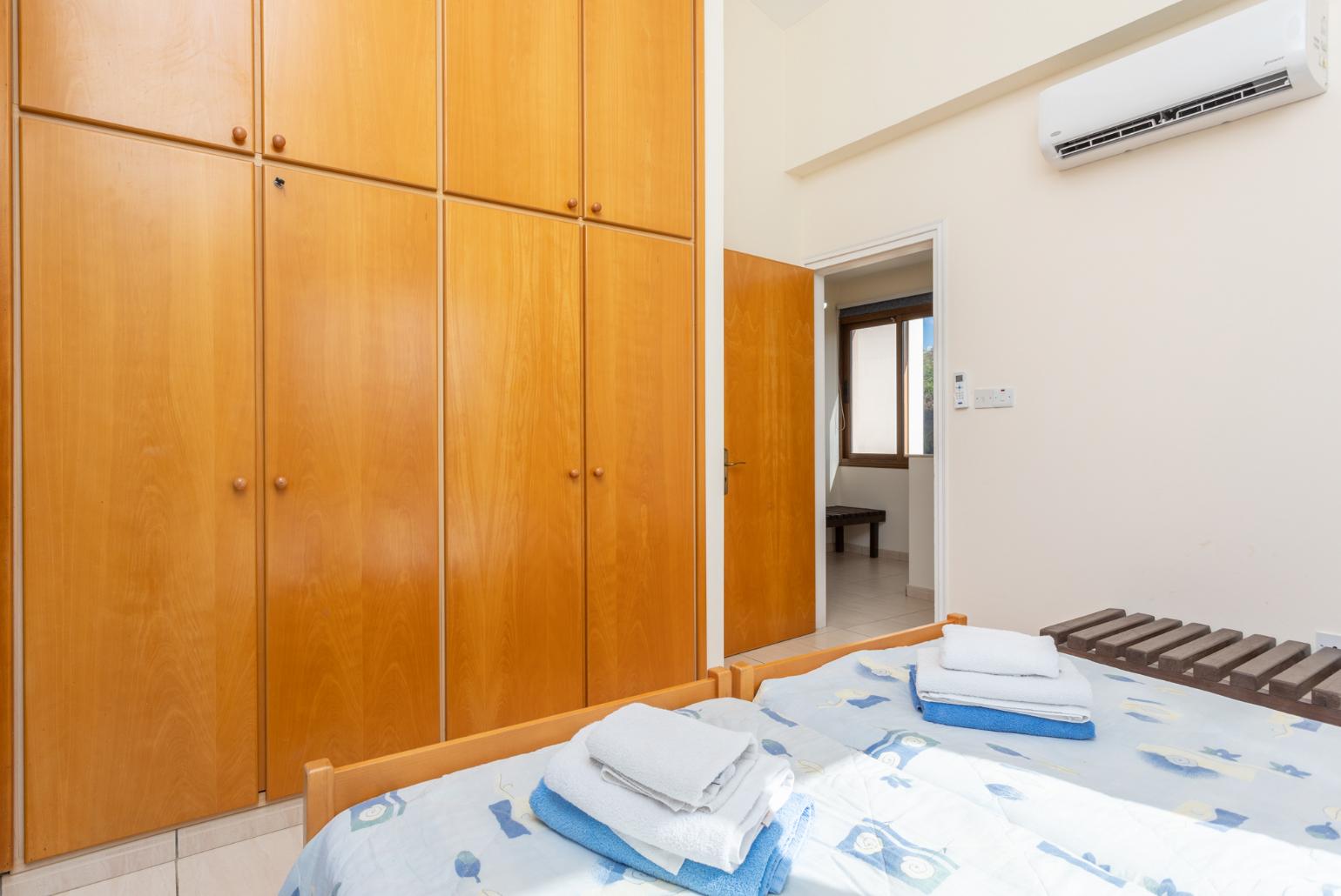 Twin bedroom with with A/C, sea views, and balcony access