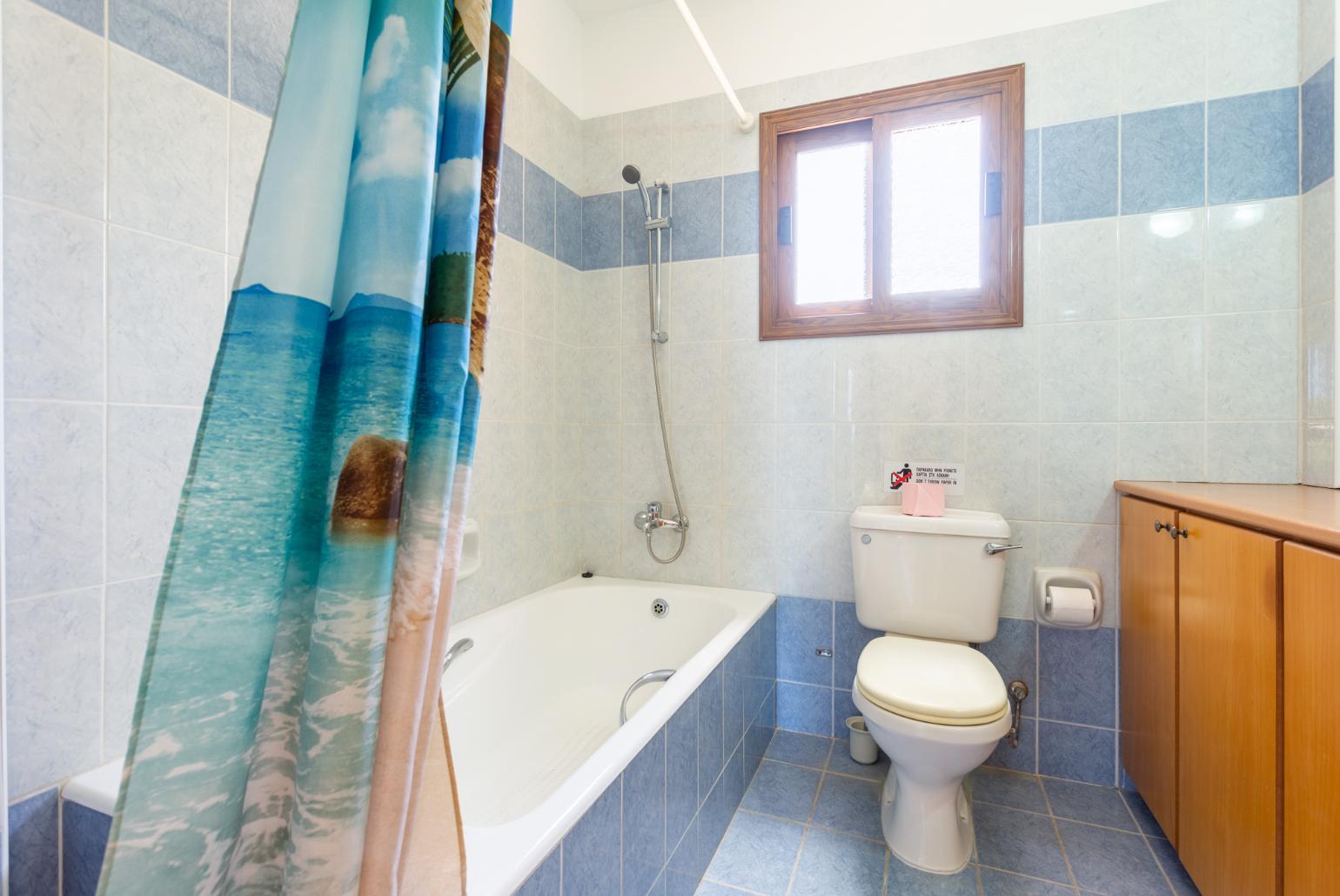 Family bathroom with bath and shower