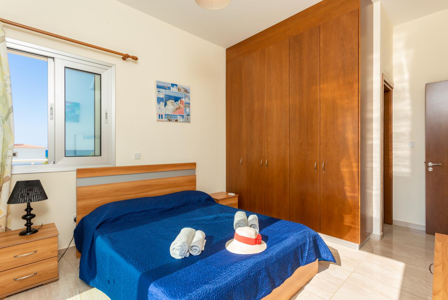 Double bedroom with en suite bathroom, A/C, and upper terrace access with sea views