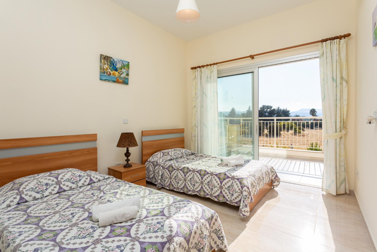 Twin bedroom with en suite bathroom, A/C, and upper terrace access with sea views