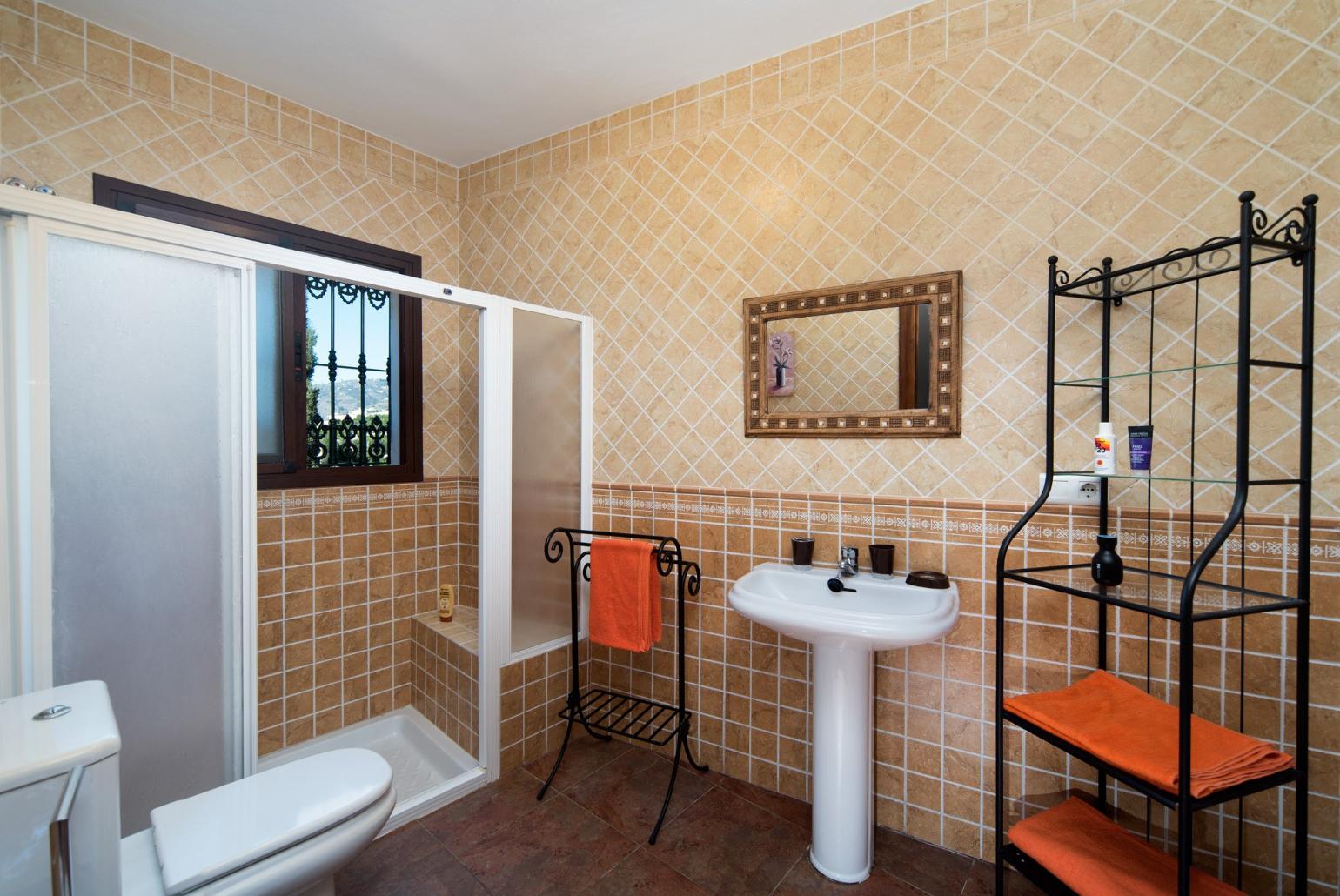 En suite bathroom with shower. W/C.