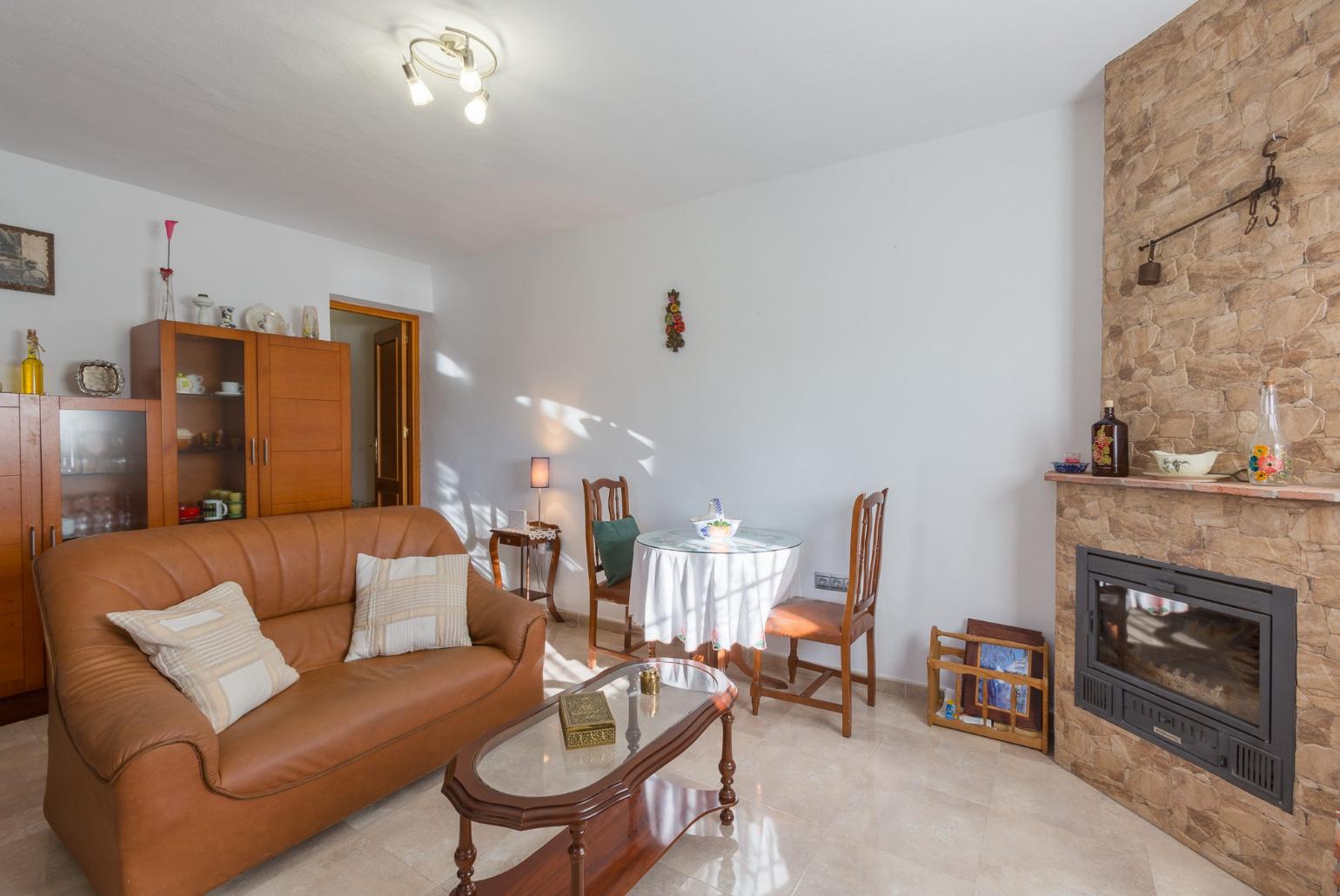 Living room has sofas, WiFi Internet, Satellite TV, DVD player, dining area and ornamental fire place and Equipped kitchen