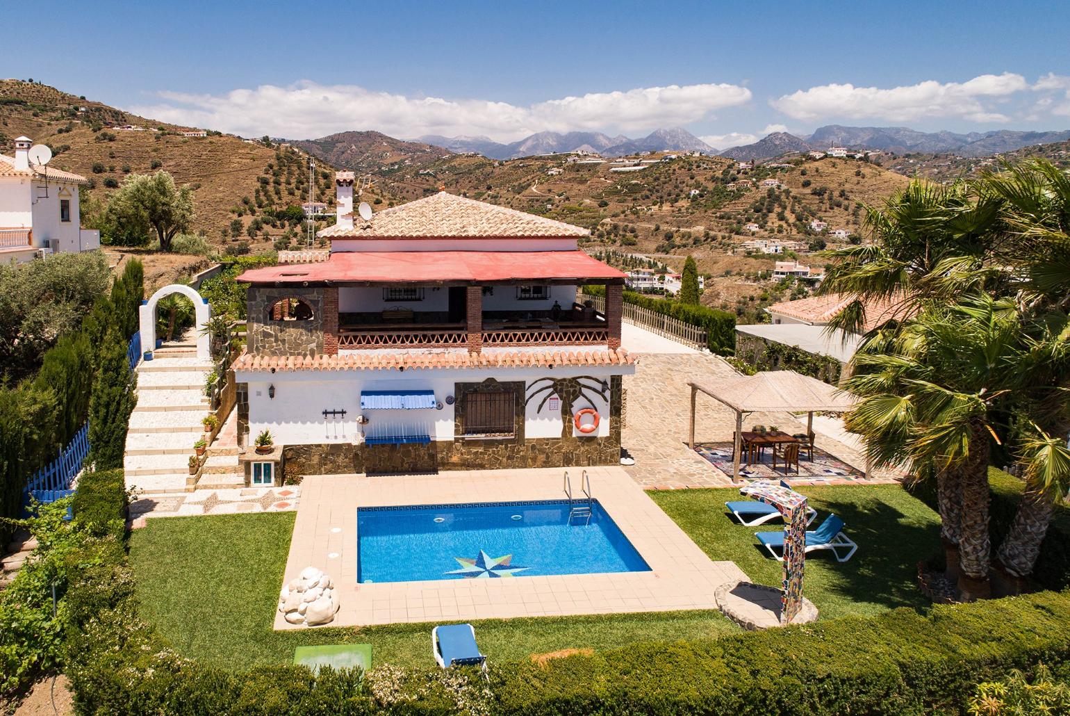 Aerial view of the  villa and pool 