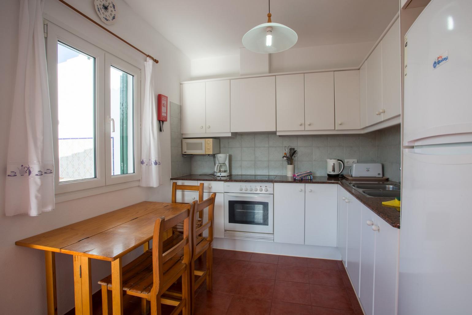 Equipped kitchen and dining area