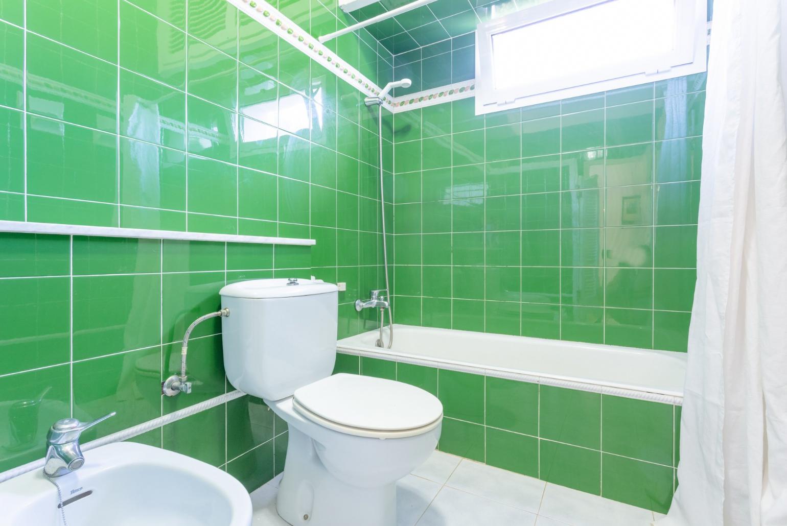Family bathroom with bath and shower