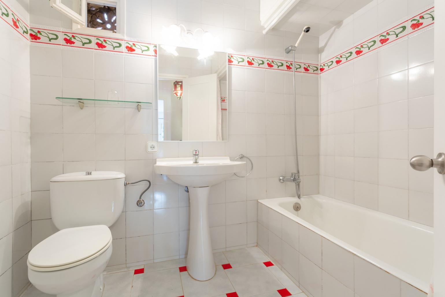 Family bathroom with bath and shower