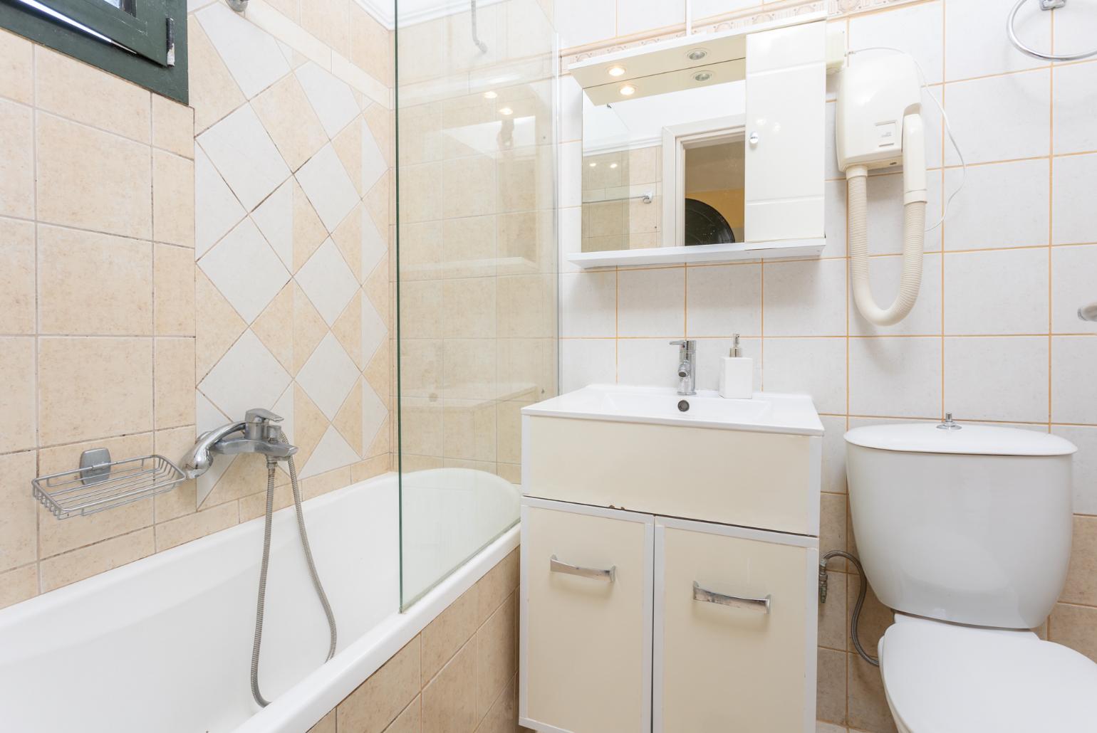 Family bathroom with bath and shower