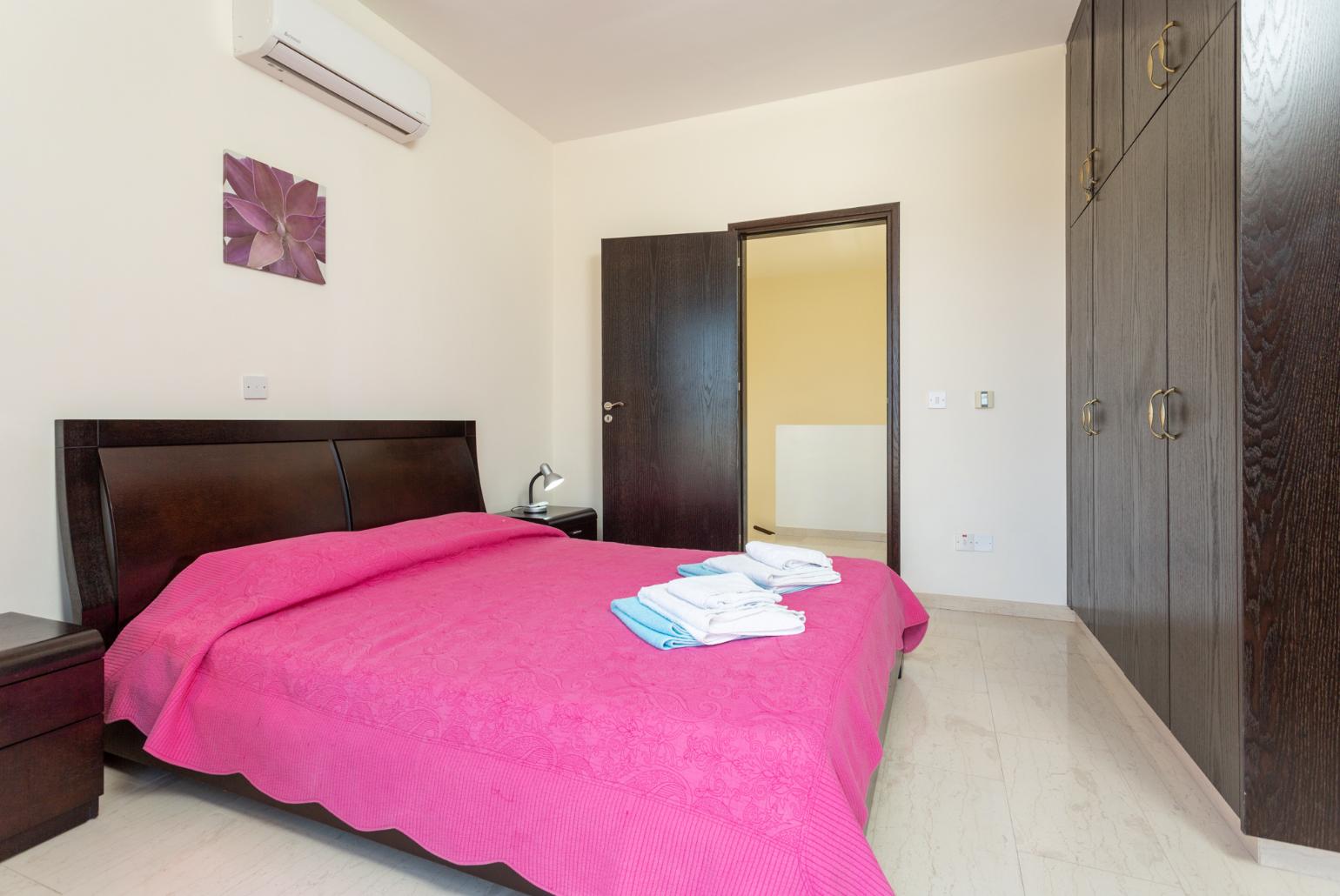 Double bedroom with en suite bathroom, A/C, and upper terrace access with sea views