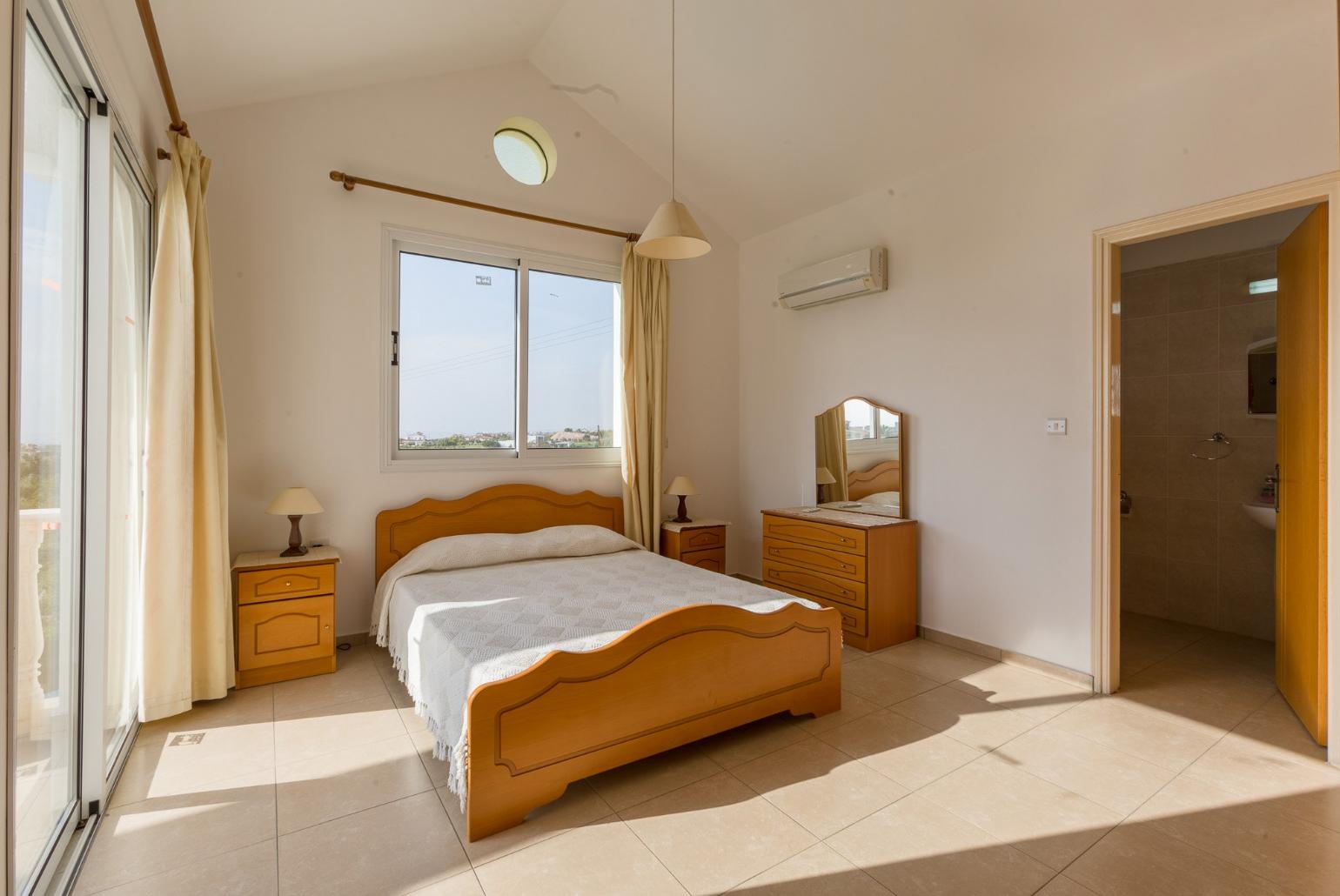 Double bedroom with A/C and en suite bathroom