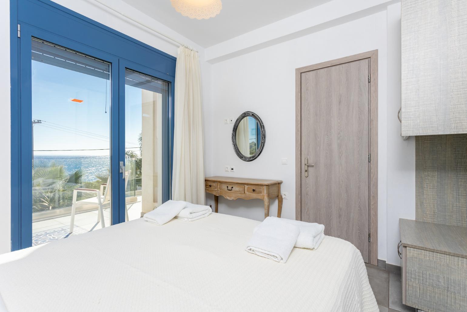 Double bedroom with A/C, sea views, and upper terrace access