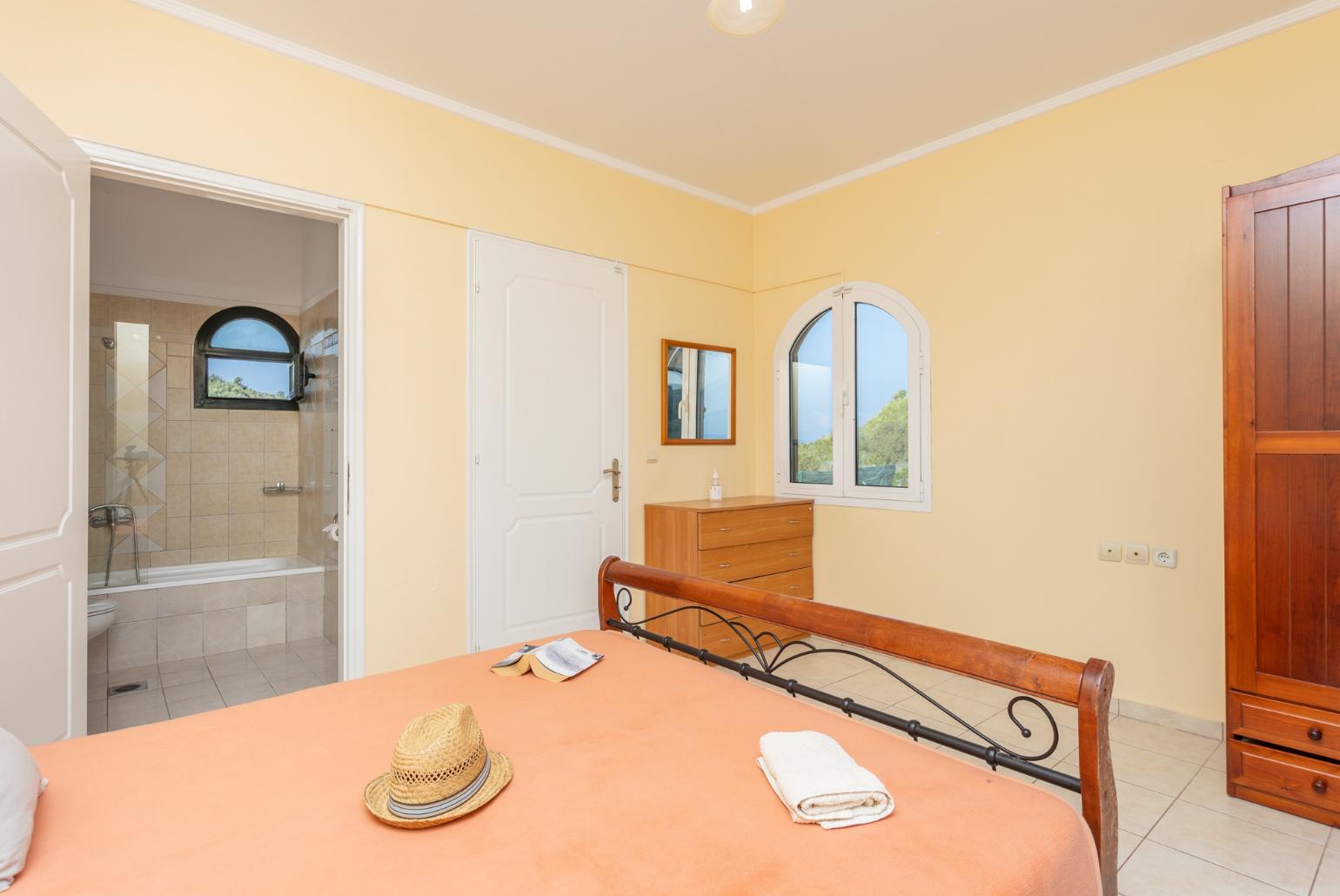 Double bedroom with en suite bathroom, A/C, sea views, and upper terrace access