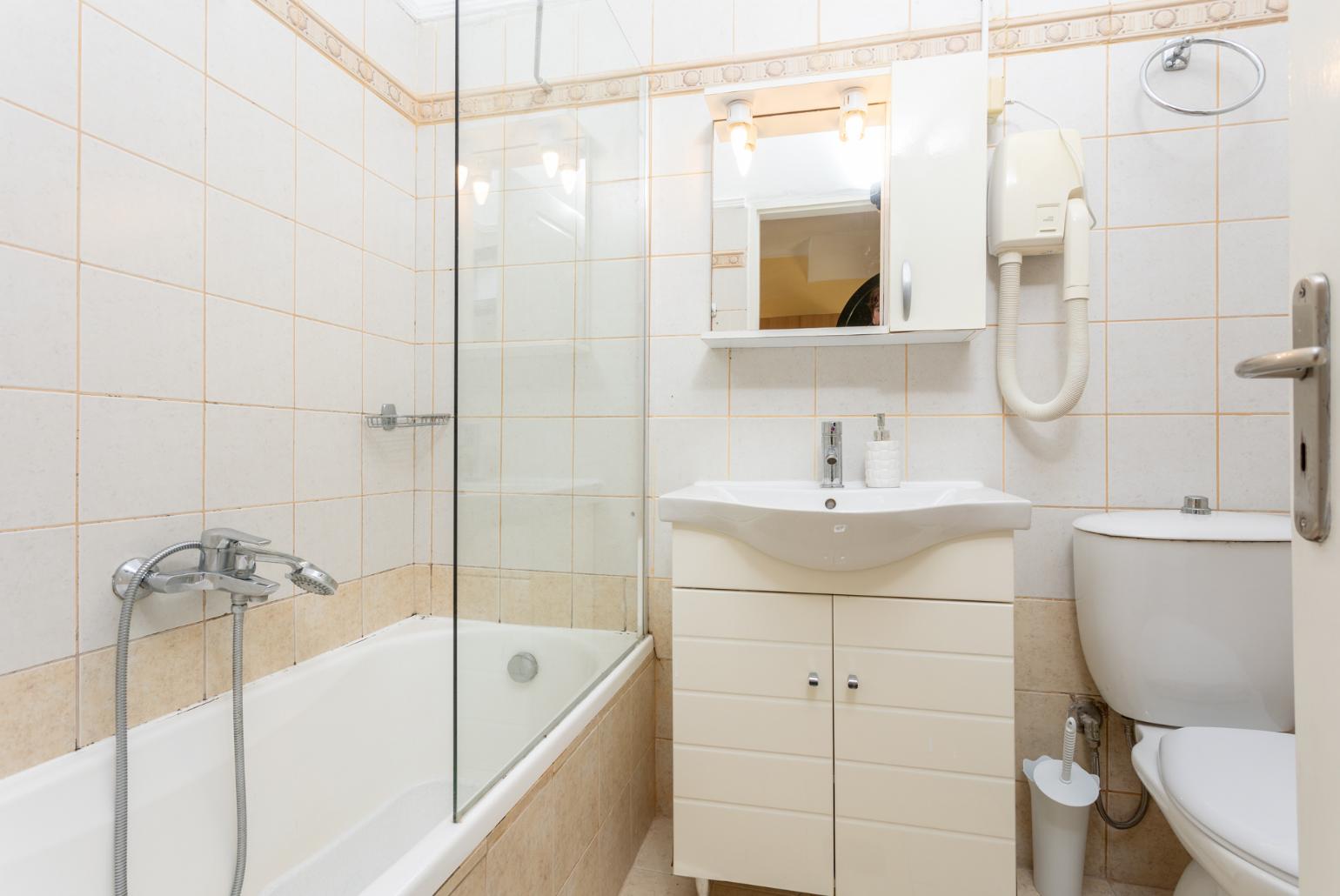 Family bathroom with bath and shower