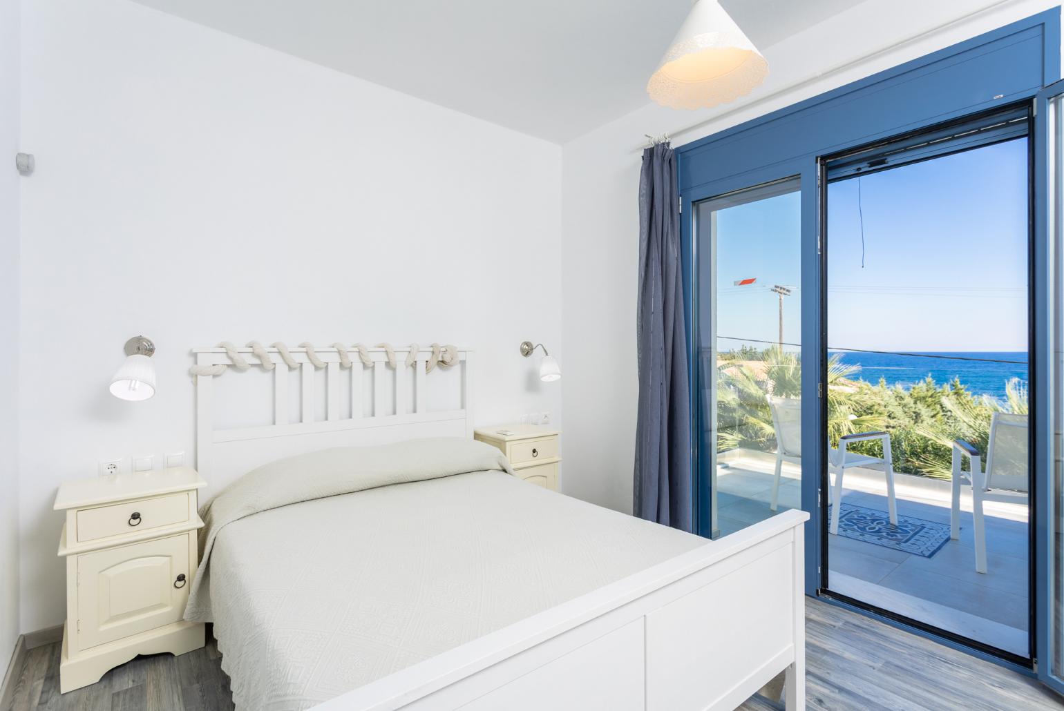 Double bedroom with A/C, sea views, and upper terrace access