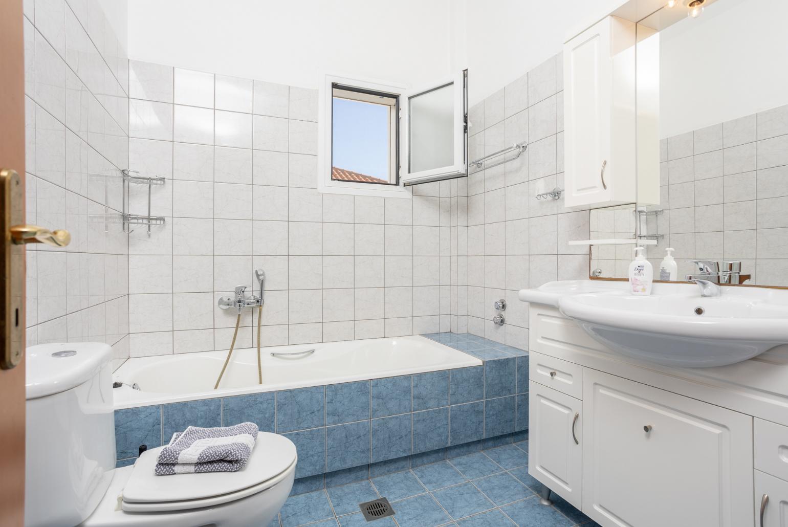 Family bathroom with bath and shower