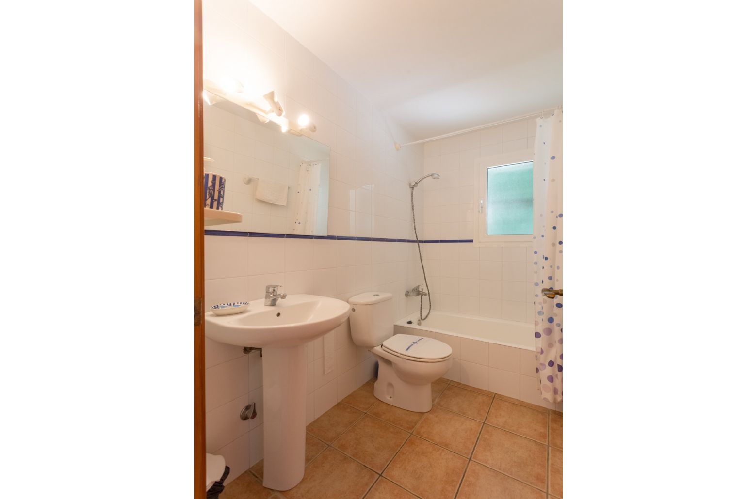 Family bathroom with bath and overhead shower