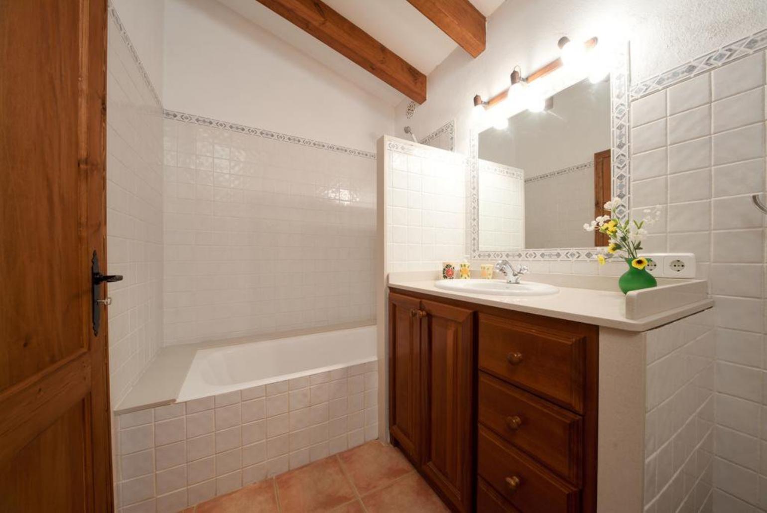 Bathroom with bath and overhead shower