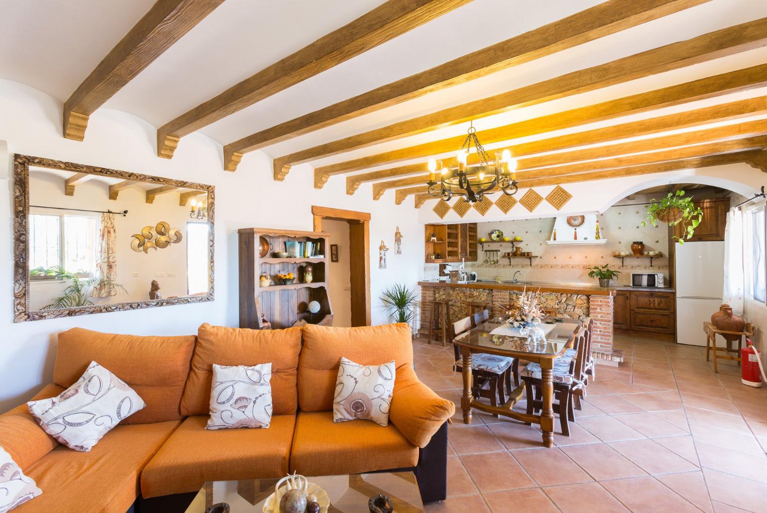 Living room with sofas, WiFi Internet, Satellite TV, DVD player, dining area and ornamental fire place.