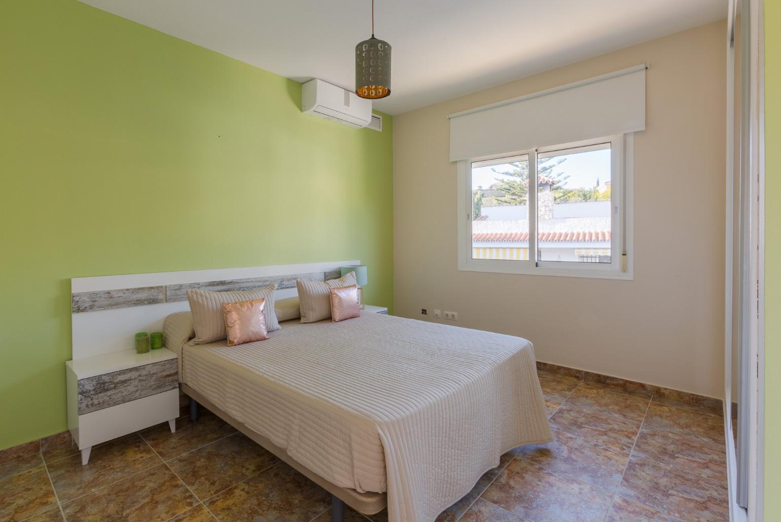 Double bedroom with A/C and balcony access