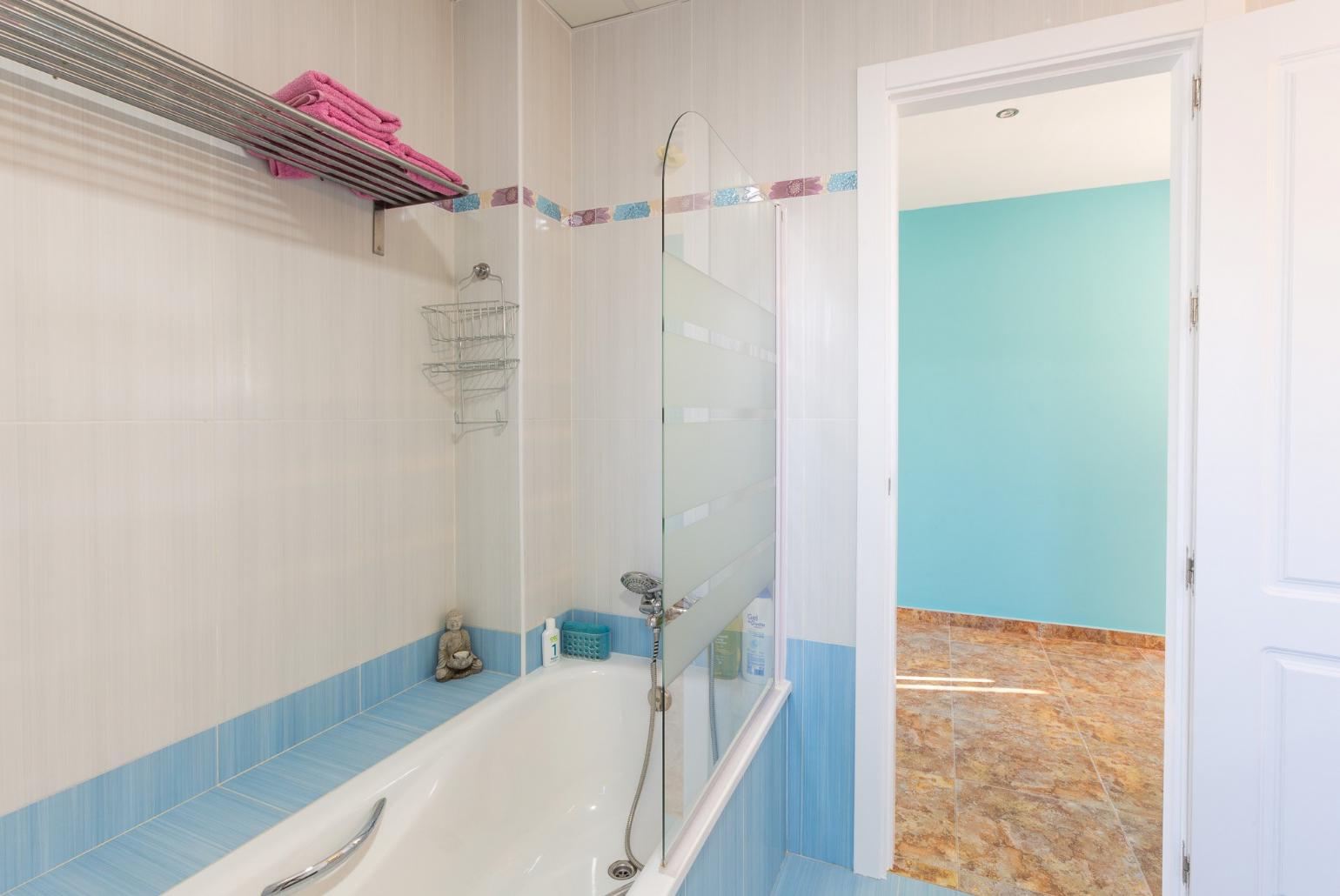 family bathroom, bath with shower. W/C.