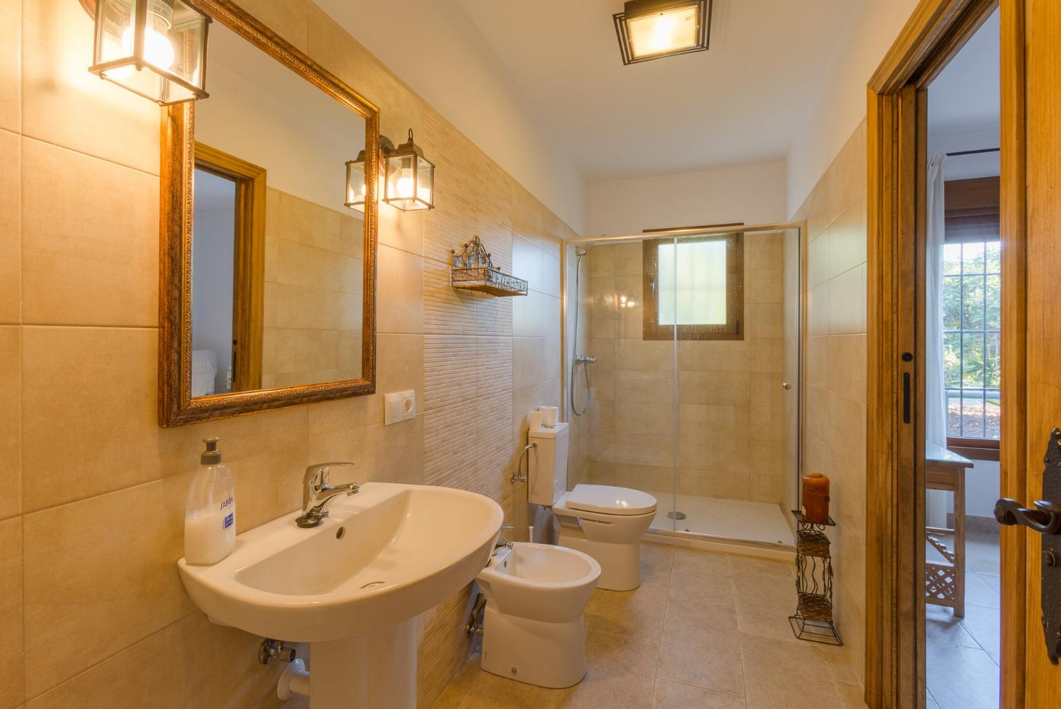 An en suite bathroom with shower. W/C.