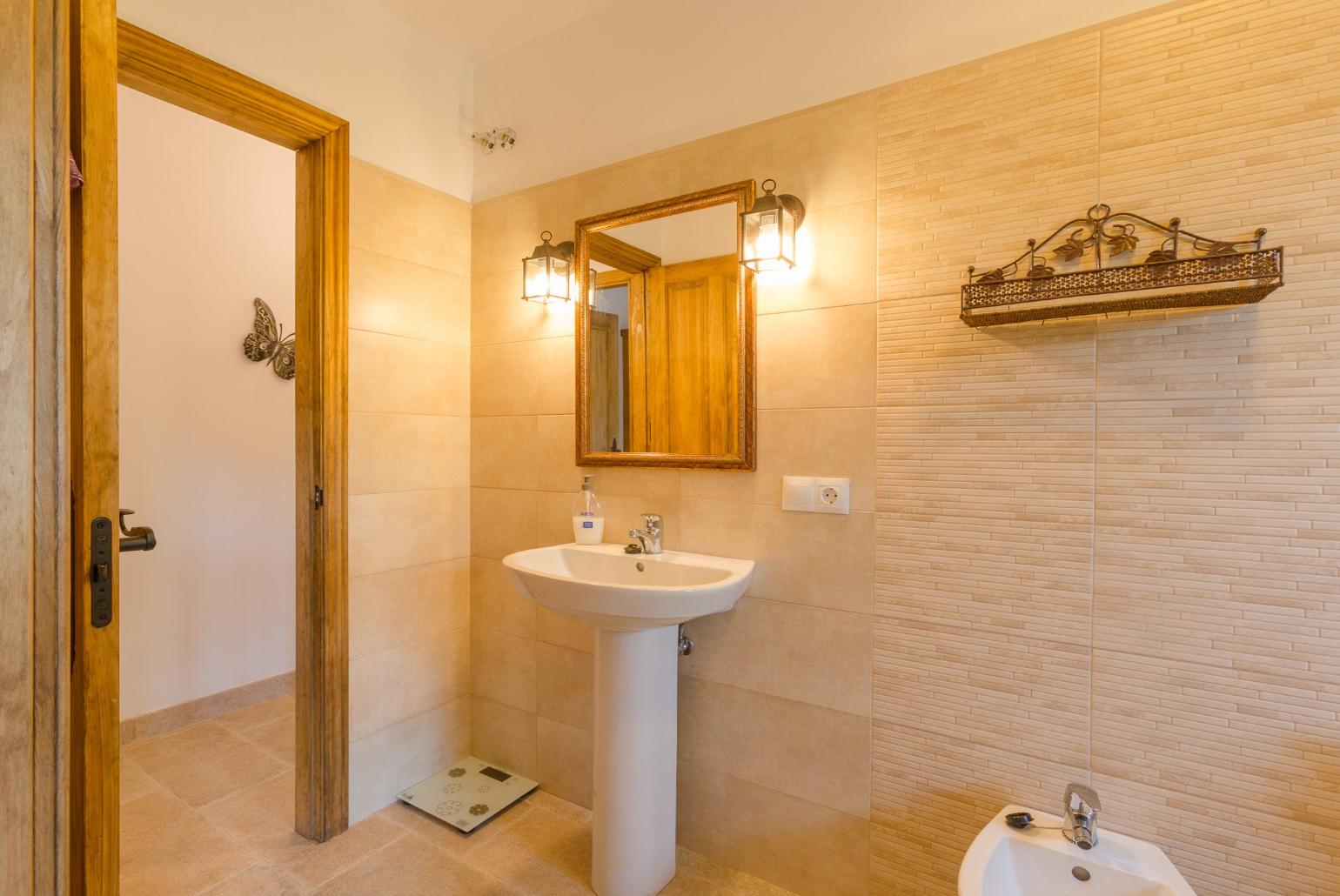 An en suite bathroom with shower. W/C.