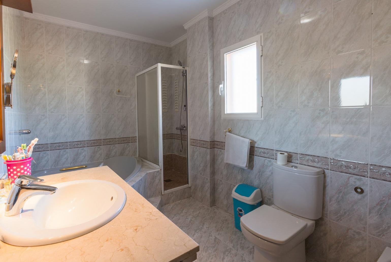 Bathroom with bathtub and shower