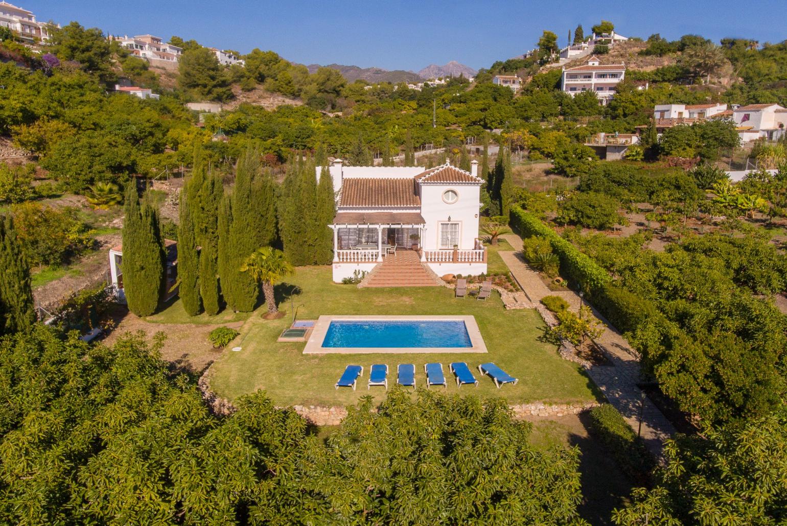 Aerial view of the villa and the pool area 