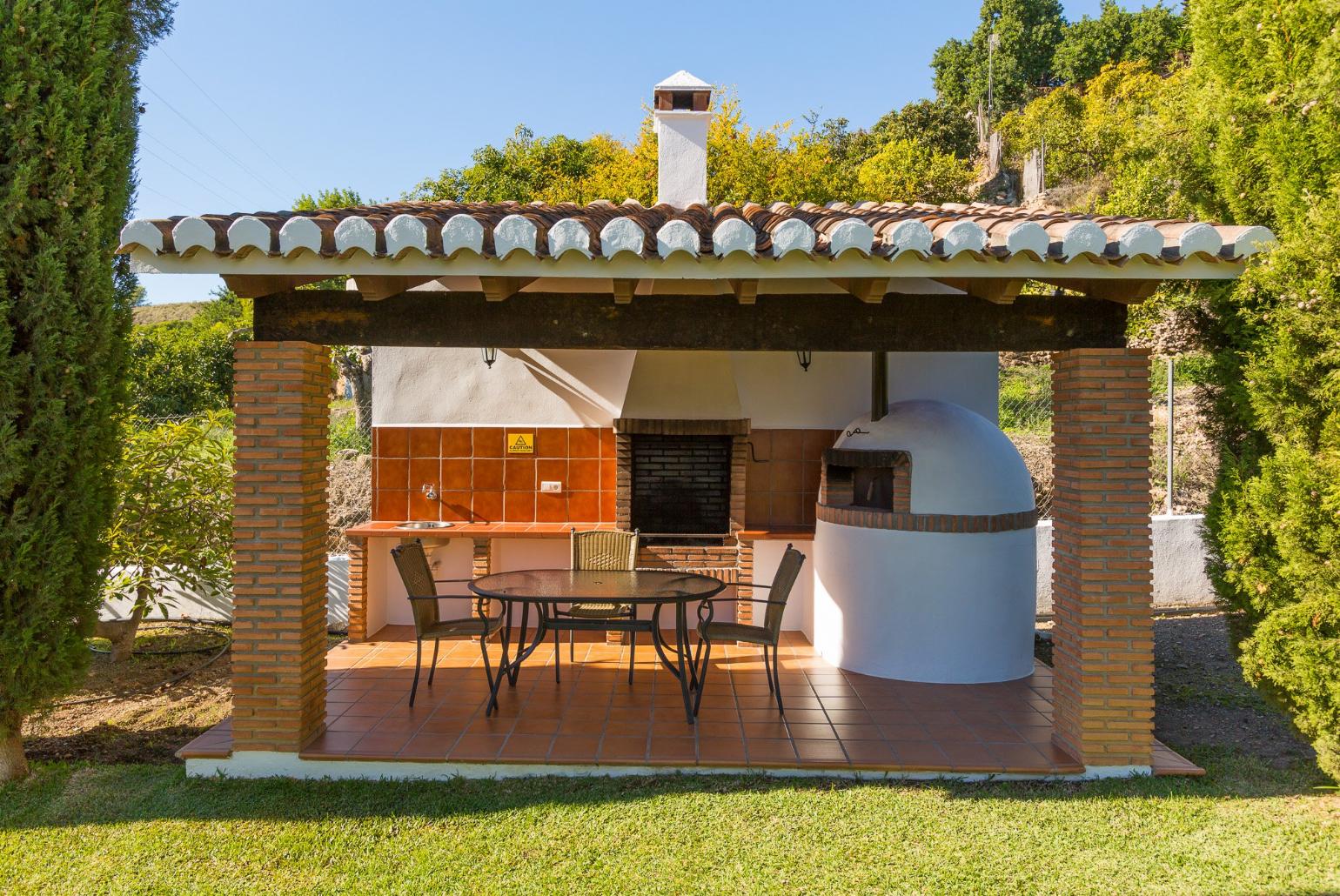 Sheltered terrace area with BBQ