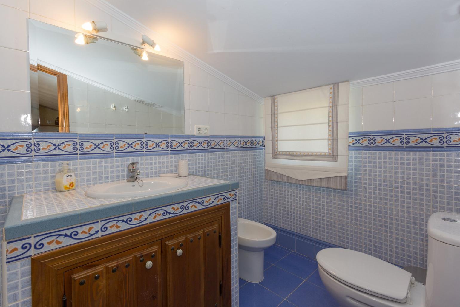 Family bathroom with shower. W/C.