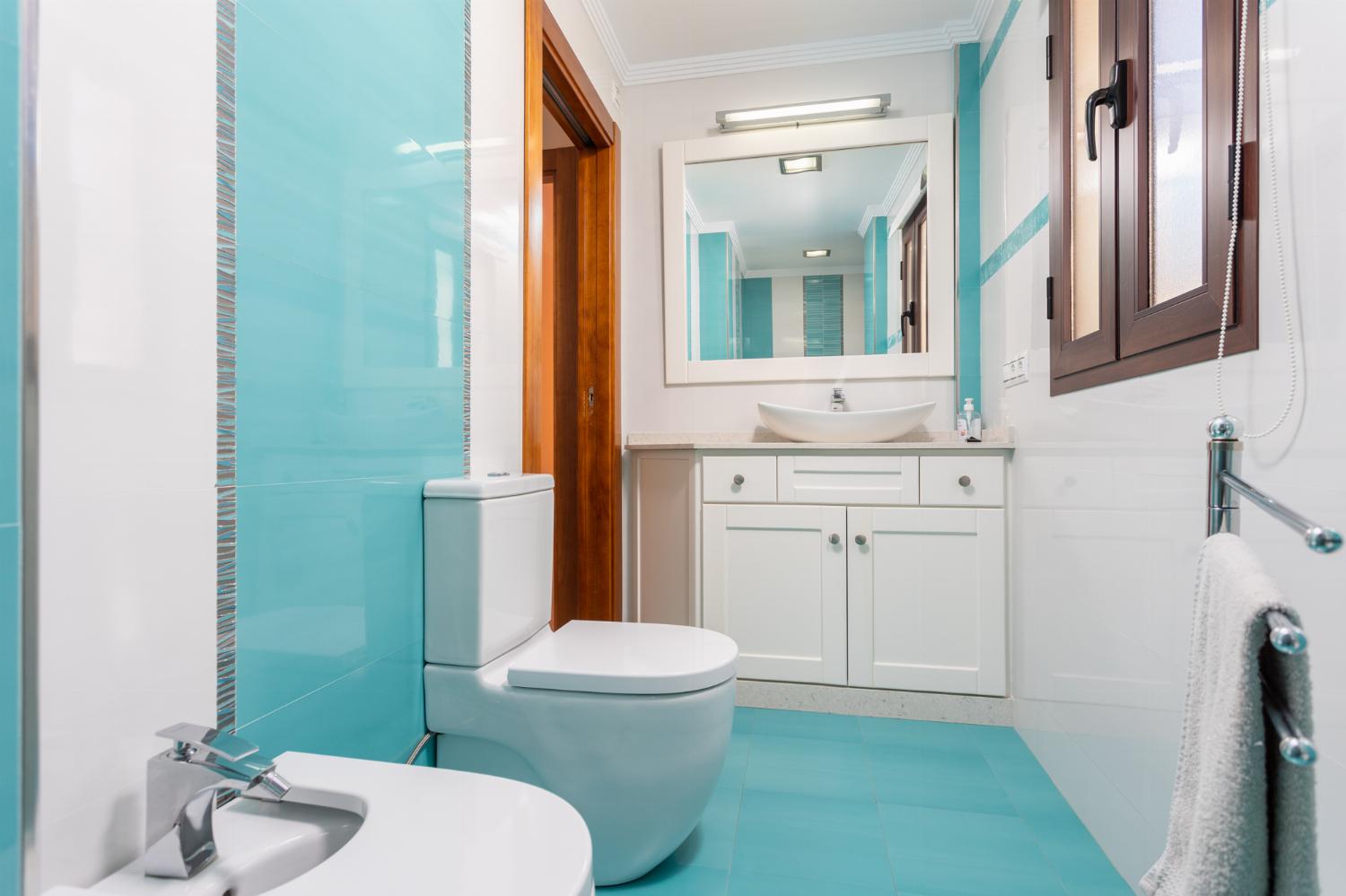 Family bathroom with bath and shower